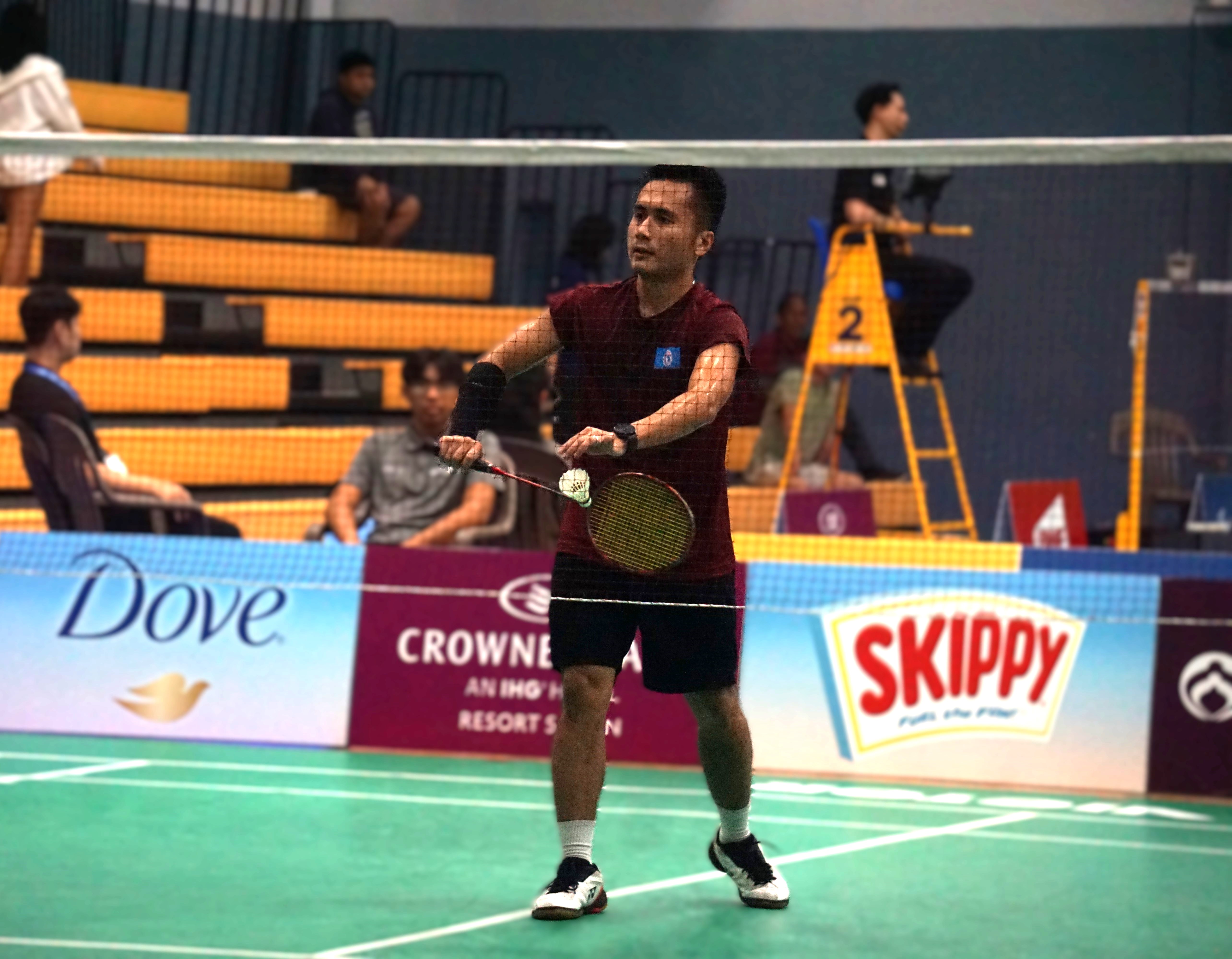 The NMI's Andreau Galvez sets up for the serve during a men's singles match against Korea’s Choi Pyeong Gang in the Crowne Plaza Northern Marianas Open 2024 at the Ada gym Tuesday.