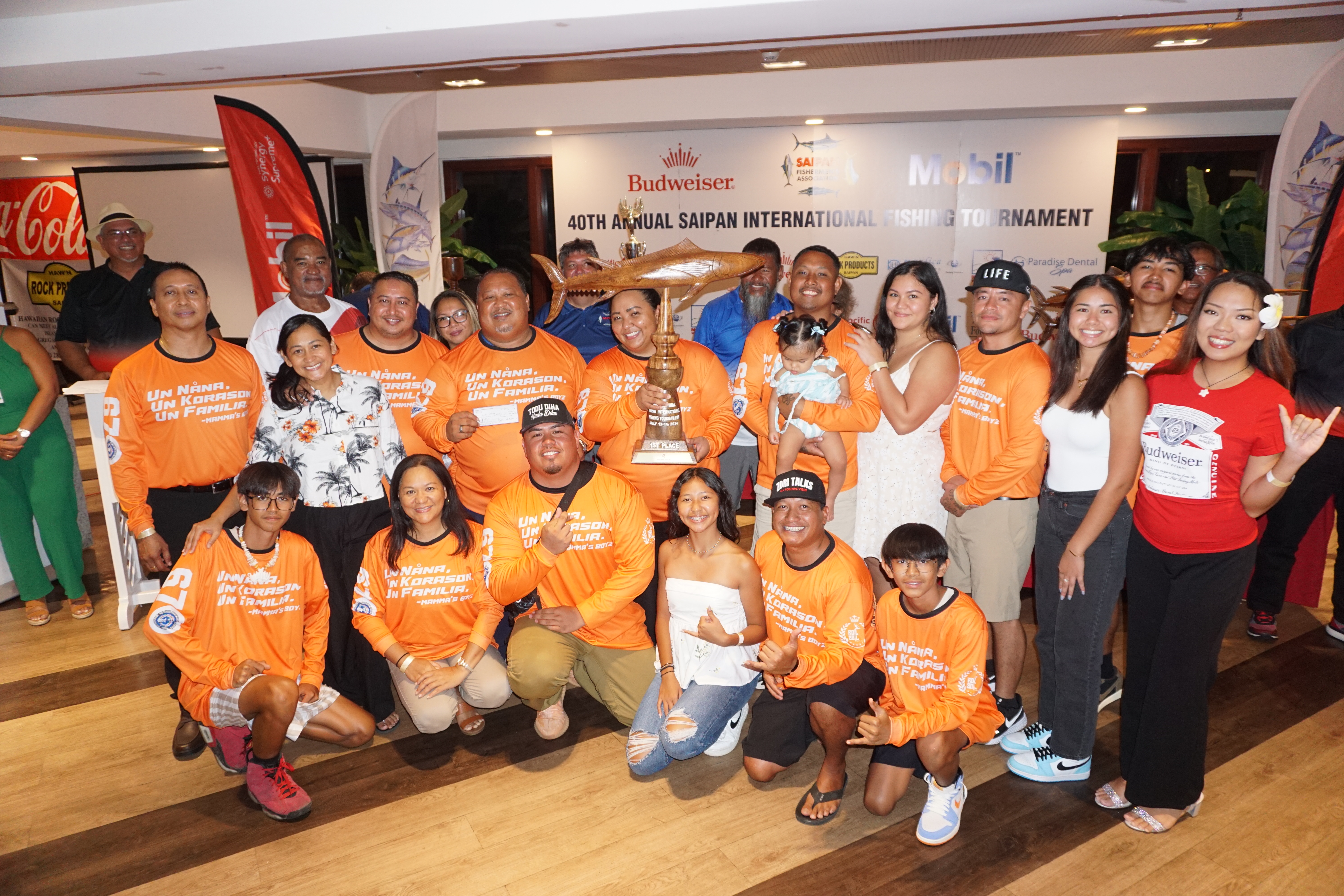 The crewmembers of Papa San pose for a photo with the first-place trophy in the wahoo category during the awards ceremony of the SFA 40th Annual Saipan International Fishing Derby at the Pacific Islands Club on Monday night.