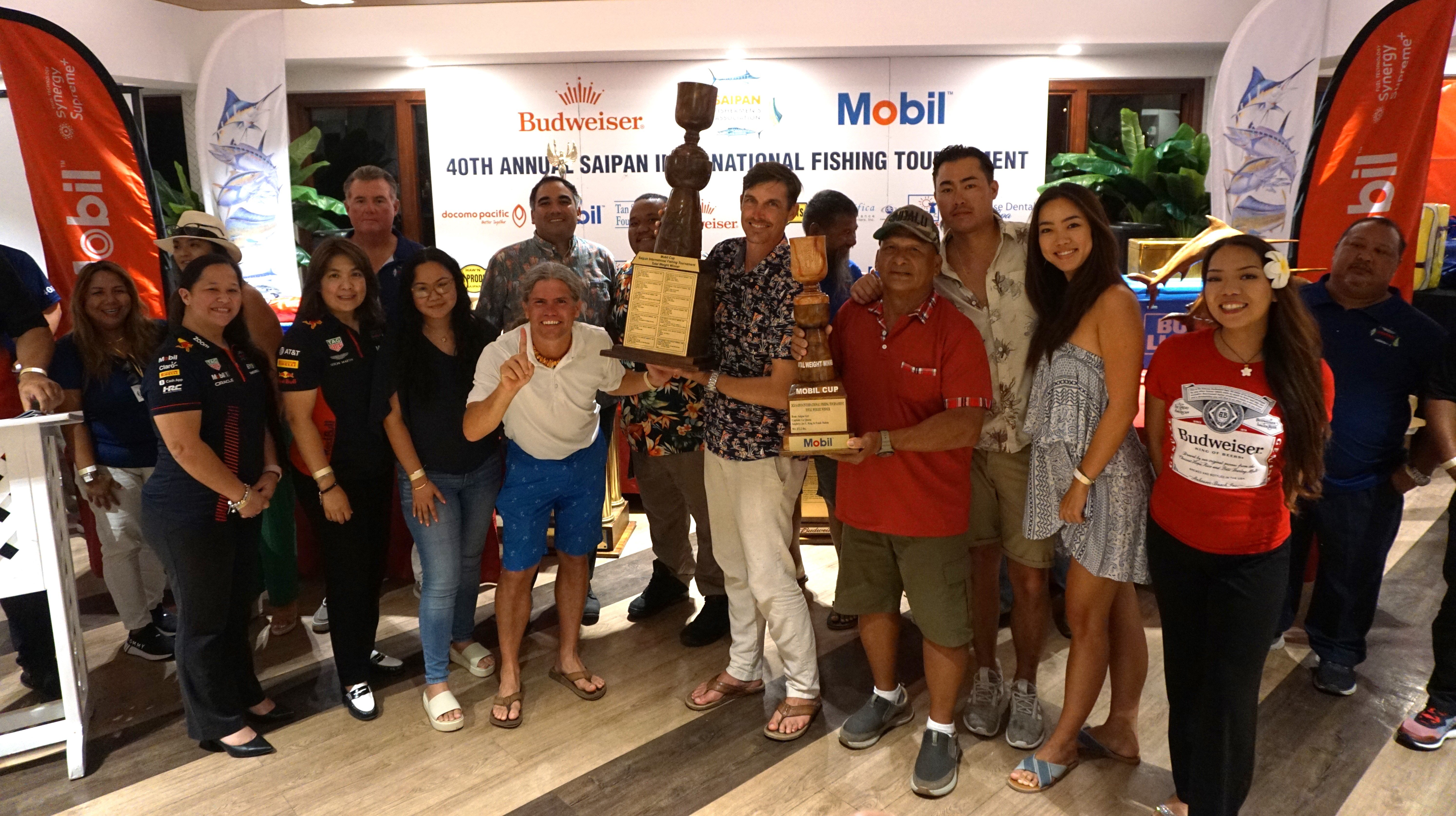 Hello Fishy crewmembers pose with the Total Weight trophy during the awards banquet of the SFA 40th Annual Saipan International Fishing Derby at the Pacific Islands Club on Monday. Hello Fishy’s total haul weighed 319.4 pounds.