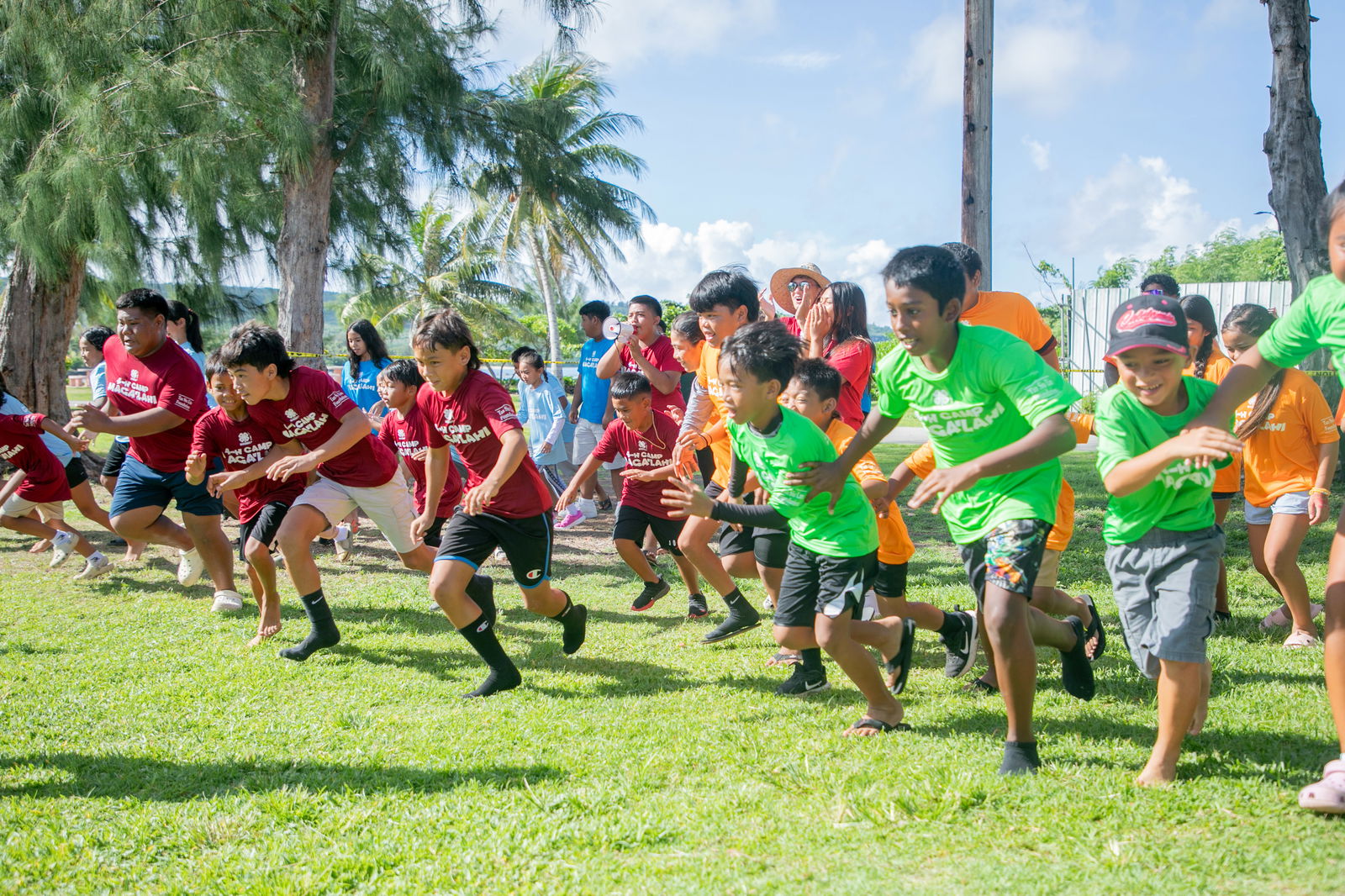 4-H Camp Maga’lahi summer campers sprint to victory during one of their outdoor sports tournaments.