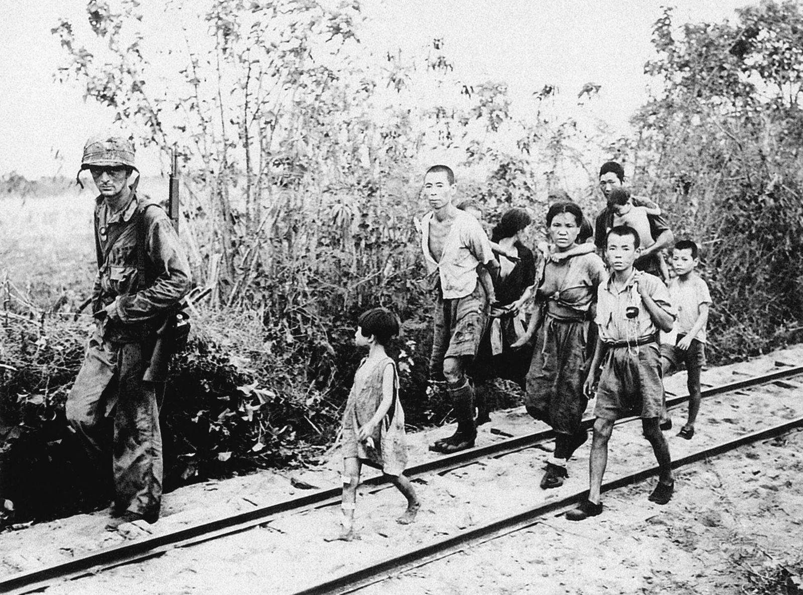 A U.S. servicemember and Japanese civilians.