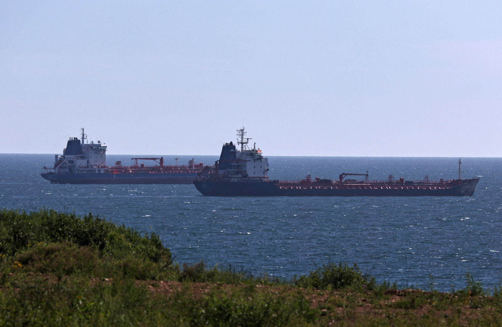 Oil tankers sail along Nakhodka Bay near the port city of Nakhodka, Russia, Aug. 12, 2022.
