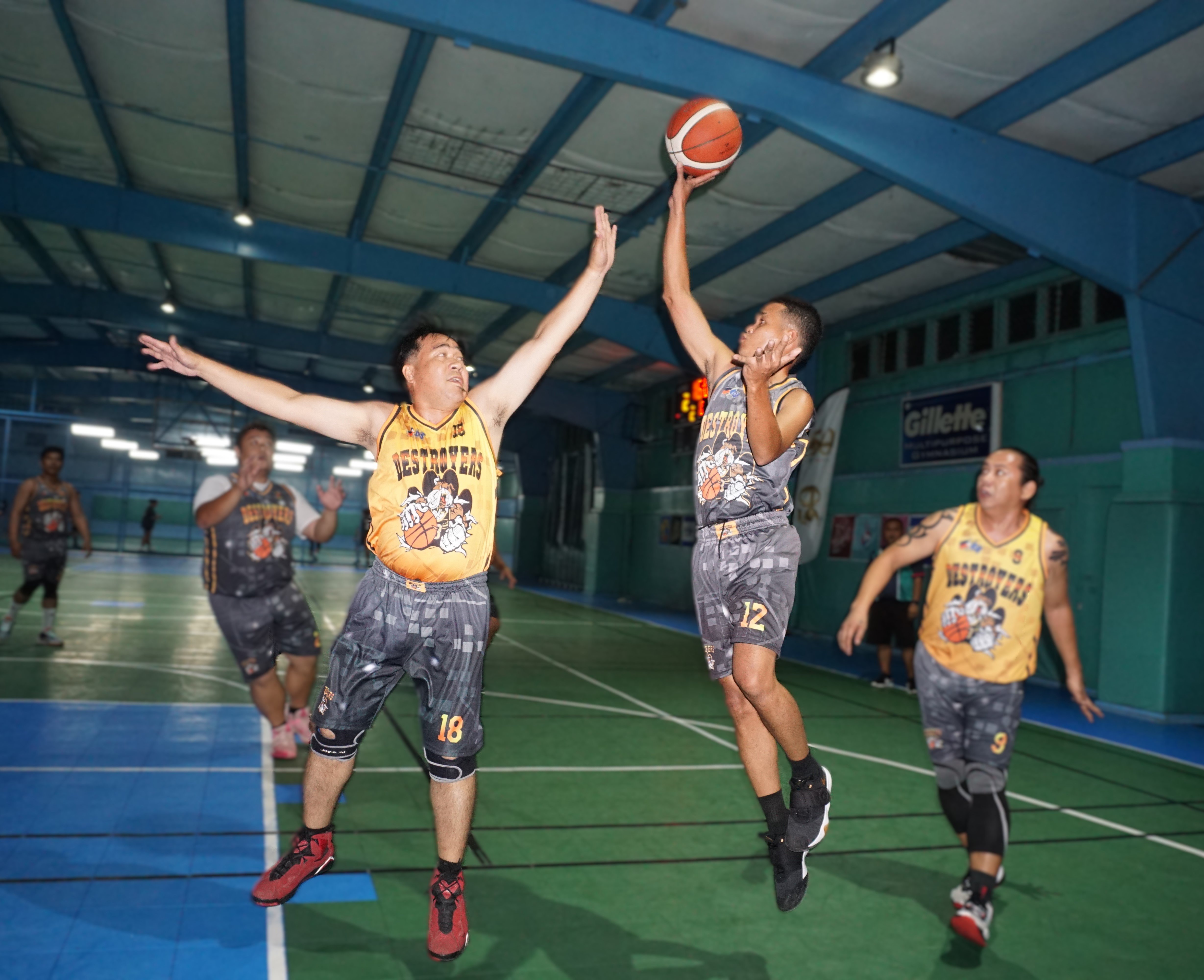 Elite Force's Manuel Gatbonton attempts a floater over Vizion Insurance's Rico Morales during a semifinals game of the 2024 Destroyers Friendly Games League at the TSL Sports Complex on Sunday.