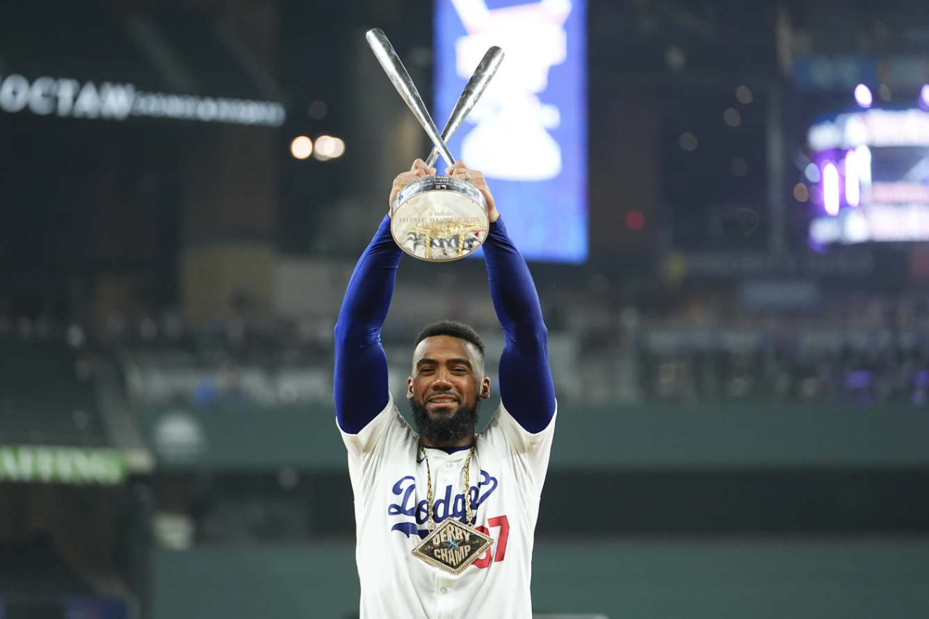 Teoscar Hernández of the LA Dodgers poses for photos with the winner’s trophy after the MLB baseball All-Star Home Run Derby, Monday, July 15, 2024 in Arlington, Texas.