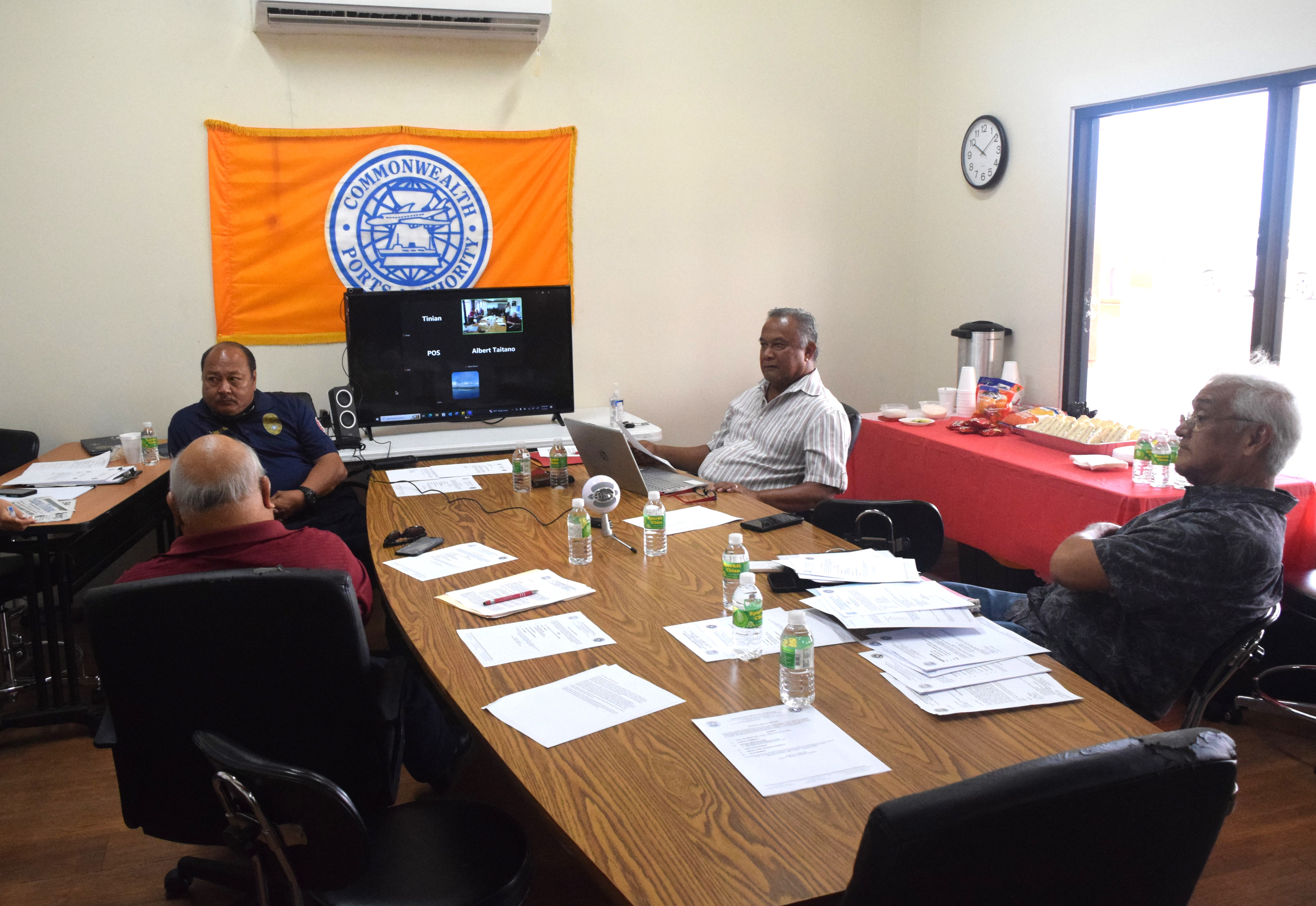 Commonwealth Ports Authority board members Ramon Tebuteb, center, Steve Mesngon, left, Thomas Villagomez, right, and board Vice Chairman Antonio Cabrera, back to the camera, meet on Wednesday.