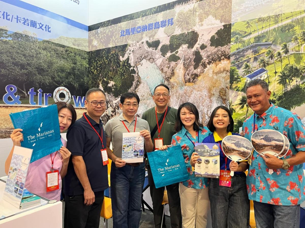 Representatives of Skydive Saipan and CENTOURS present a small prize to a lucky trivia game winner at Taiwan International Tourism Expo 2024 on Aug. 16-19, 2024, in Taipei. The Marianas Visitors Authority participated in the expo along with the two tourism partners to promote tourism attractions in Saipan, Tinian, and Rota.