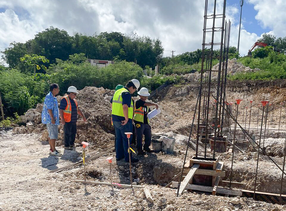 NMC Pre-Engineering students Kyle Attao and Isaac Han at a construction site.