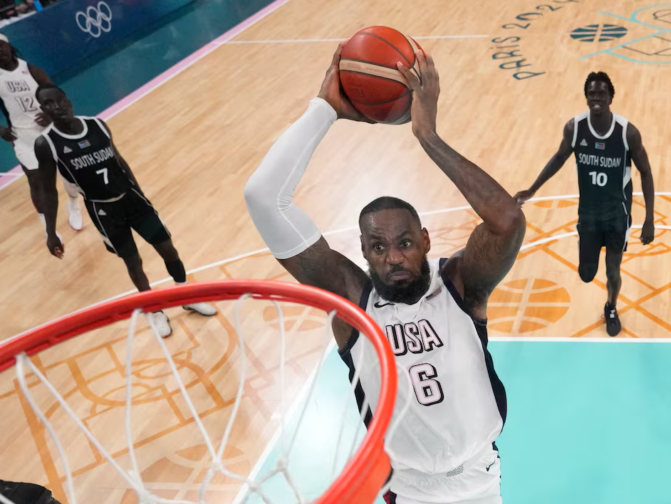 Lebron James of United States scores a basket against South Sudan at Pierre Mauroy Stadium in Villeneve-d'Ascq, France, July 31, 2024.
