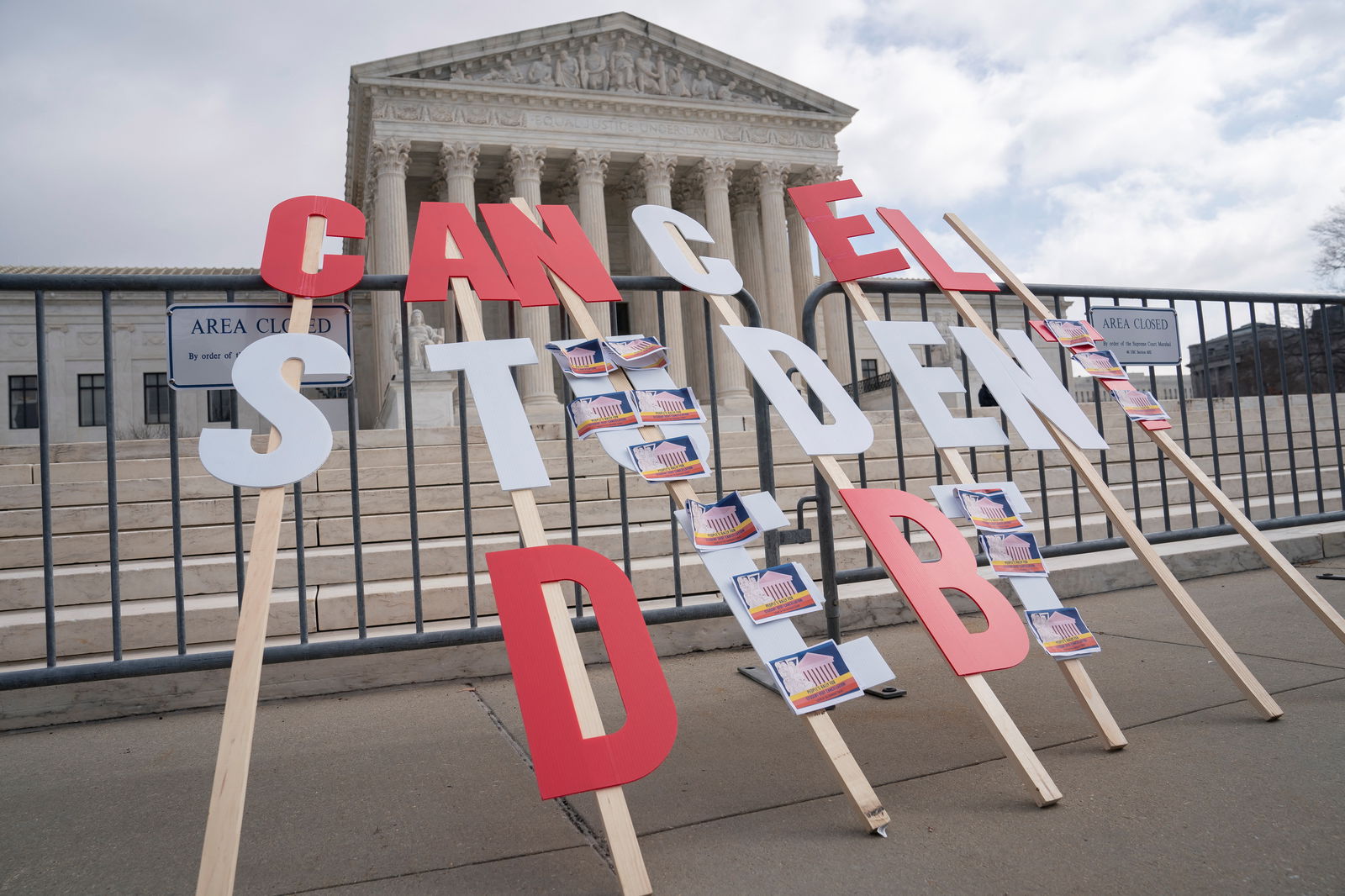 A sign calling for student loan debt relief is seen in front of the U.S. Supreme Court as the justices are scheduled to hear oral arguments in two cases involving President Joe Biden's bid to reinstate his plan to cancel billions of dollars in student debt in Washington, D.C., Feb. 28, 2023. 