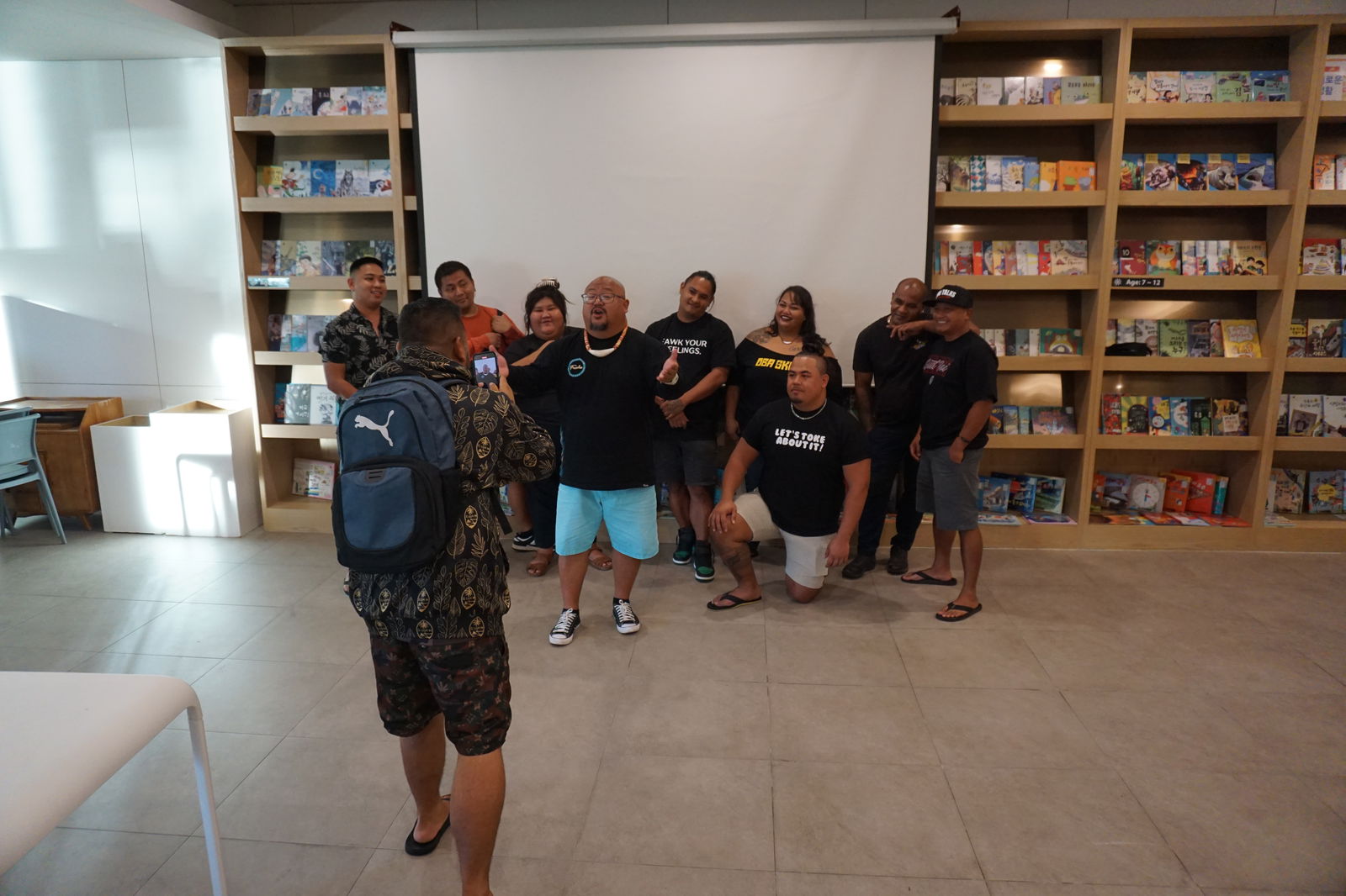 PalmTrio 670, Zori Talks, NettyCee, Chinaman and hosts Gene Castro and Songi Sessions shoot a promo video at the end of a press conference on Thursday, Aug. 8 at Saipan World Resort ahead of the “It's Not That Serious Par!” comedy event.