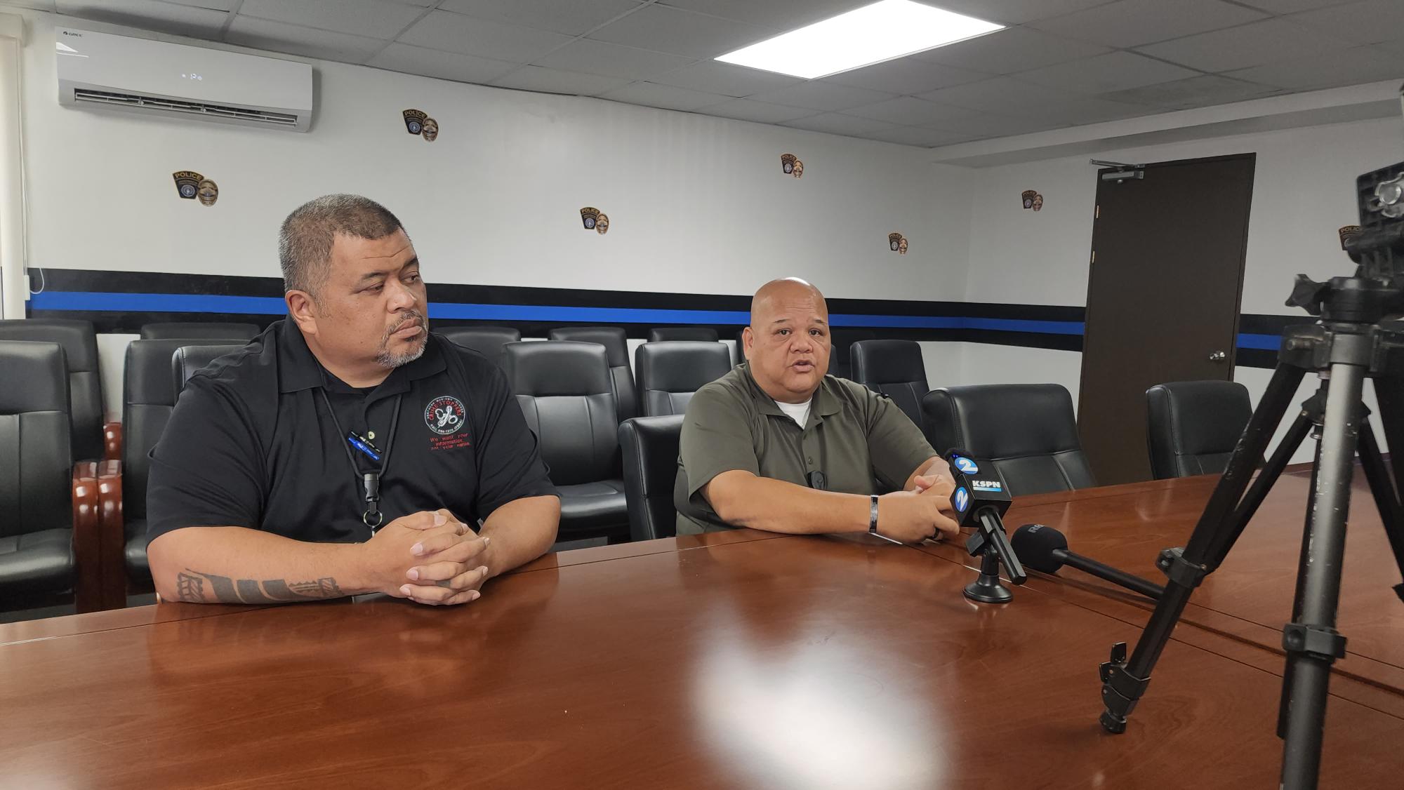 Department of Public Safety Commissioner Anthony Macaranas, right, speaks while DPS’ public information officer, Police Sgt. Fred Sato, listens during a press conference Monday morning.
