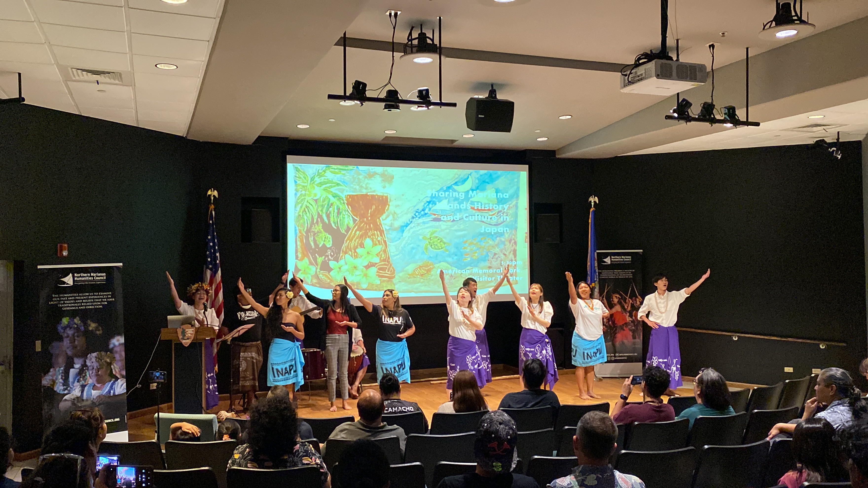 Local dancers and Nakayama's students perform on stage.