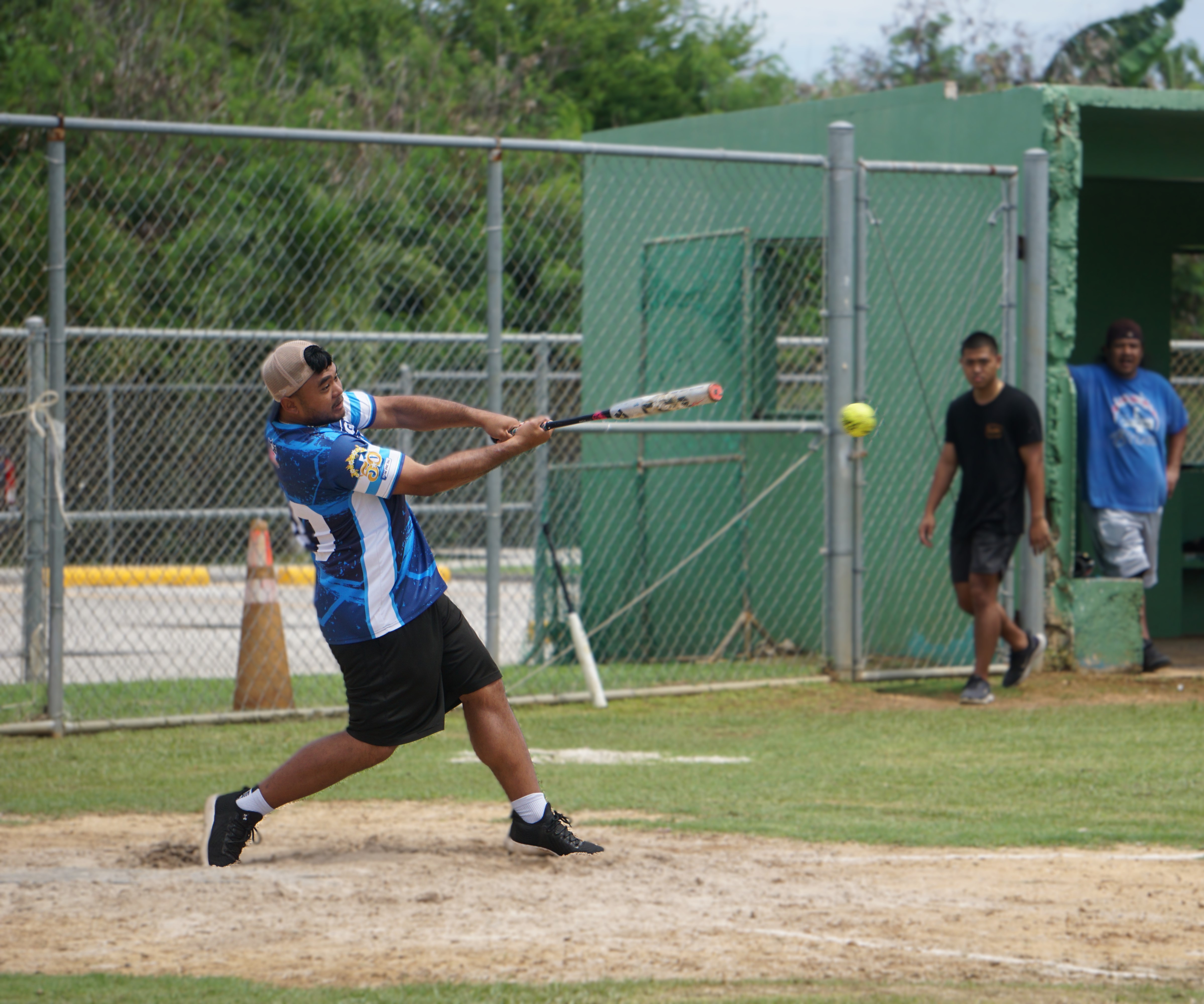 The AB Team's Greg Sablan hits a single during a game against Pare Pack in the 2024 Budweiser Belau Amateur Softball Association Open League at the Dandan baseball field on Sunday.