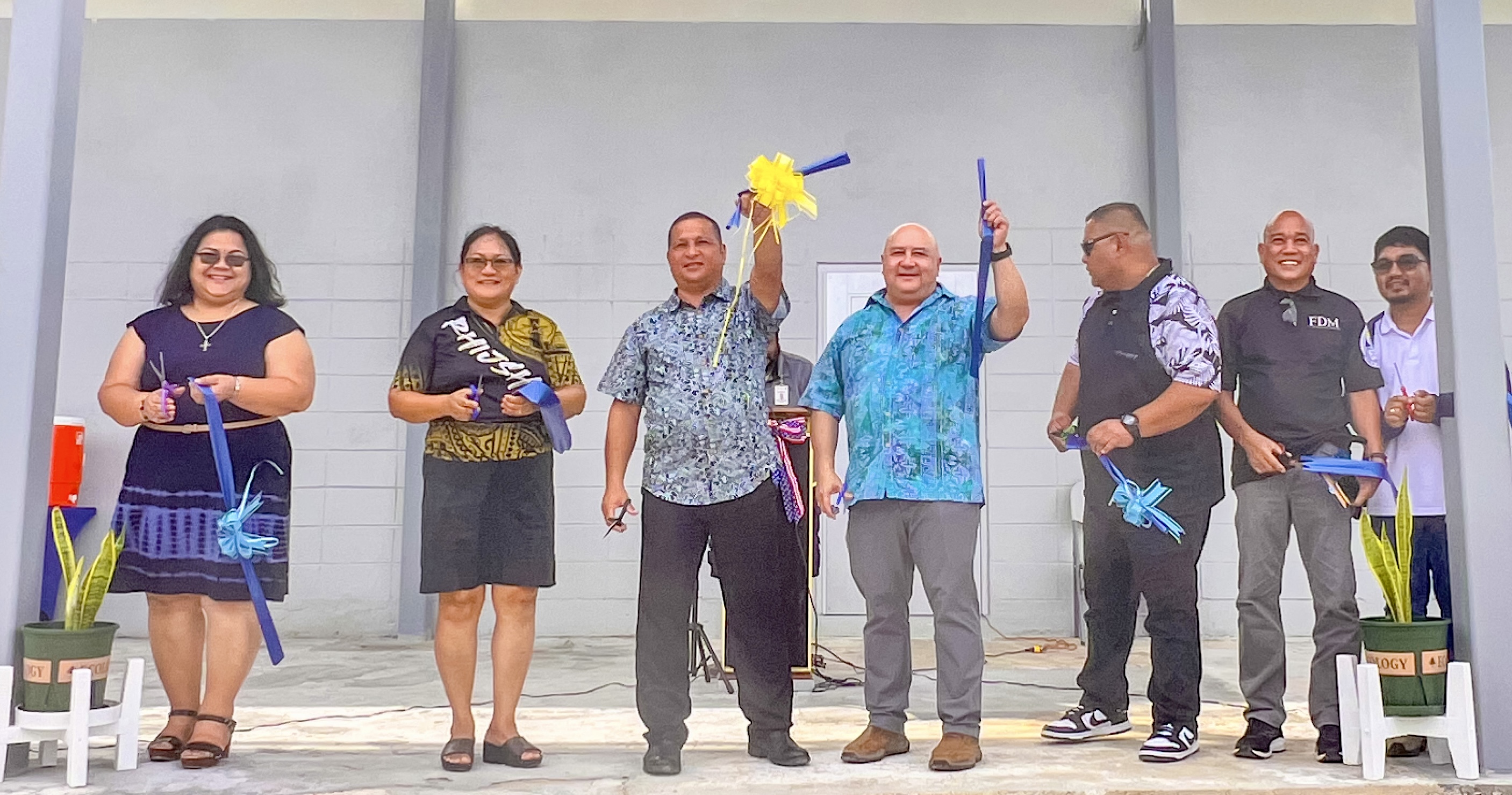 Commissioner of Education Dr. Lawrence F. Camacho, Acting Rota Mayor Jim Michael Atalig, Sinapalo Elementary School Principal Daisy Quitugua, Dr. Rita Hocog Inos Junior Senior High School Principal Annette Calvo, Rota PSS Office of Public Transportation bus lead Larry Hocog and contractor Jesus Dimaala celebrate the opening of the new Rota Office of Pupil Transportation facility in Songsong, Rota.