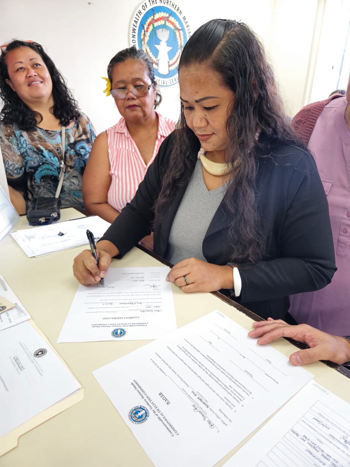 Rose Taman Rios, a CNMI Republican Party candidate for Precinct 4, certifies her nomination packet to run for the House of Representatives at the Commonwealth Election Commission on Wednesday, Aug. 7, 2024.