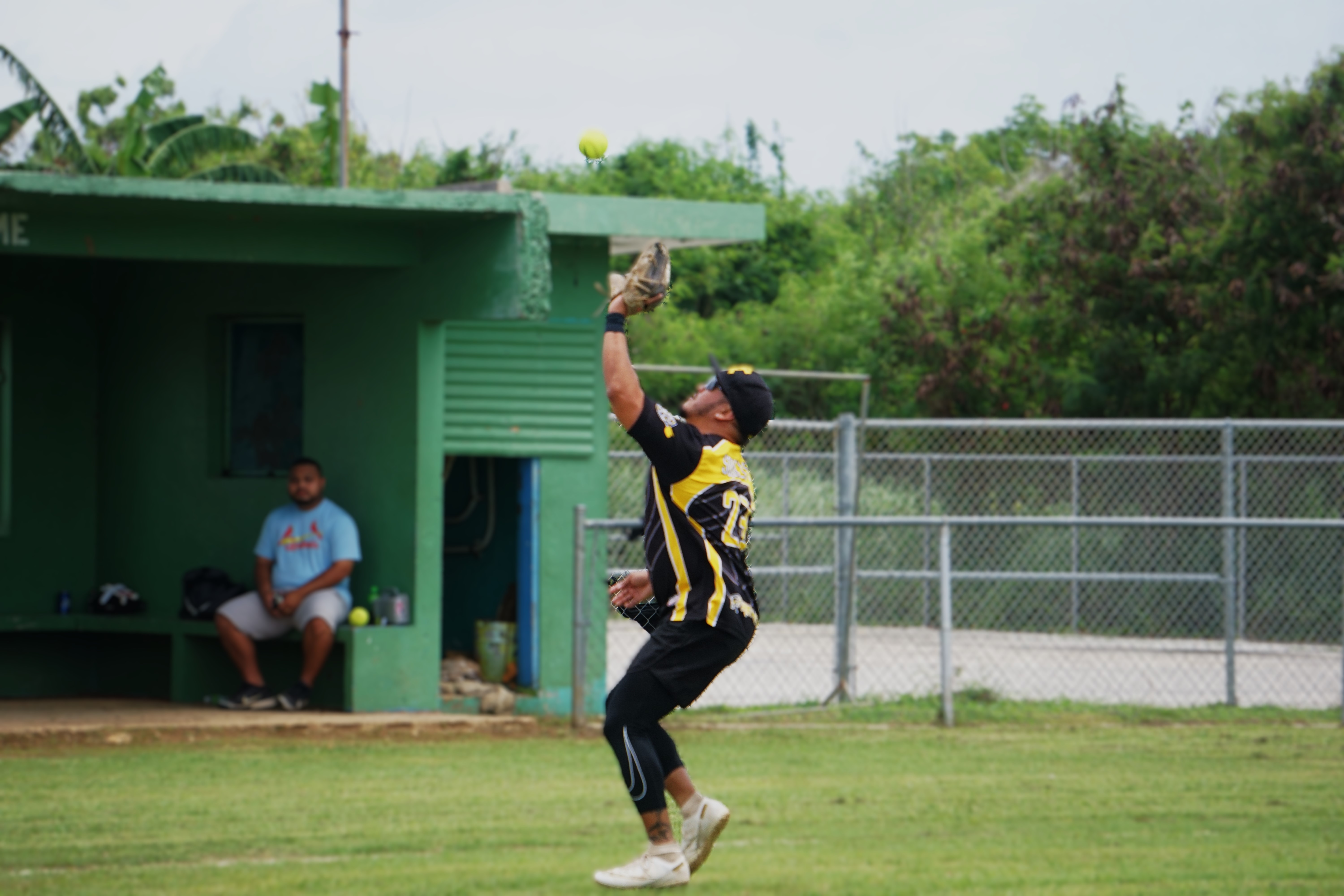 Kliq pitcher James Benavente catches a pop up during a game of the 2024 Budweiser Belau Amateur Softball Association Open League at the Dandan baseball field.