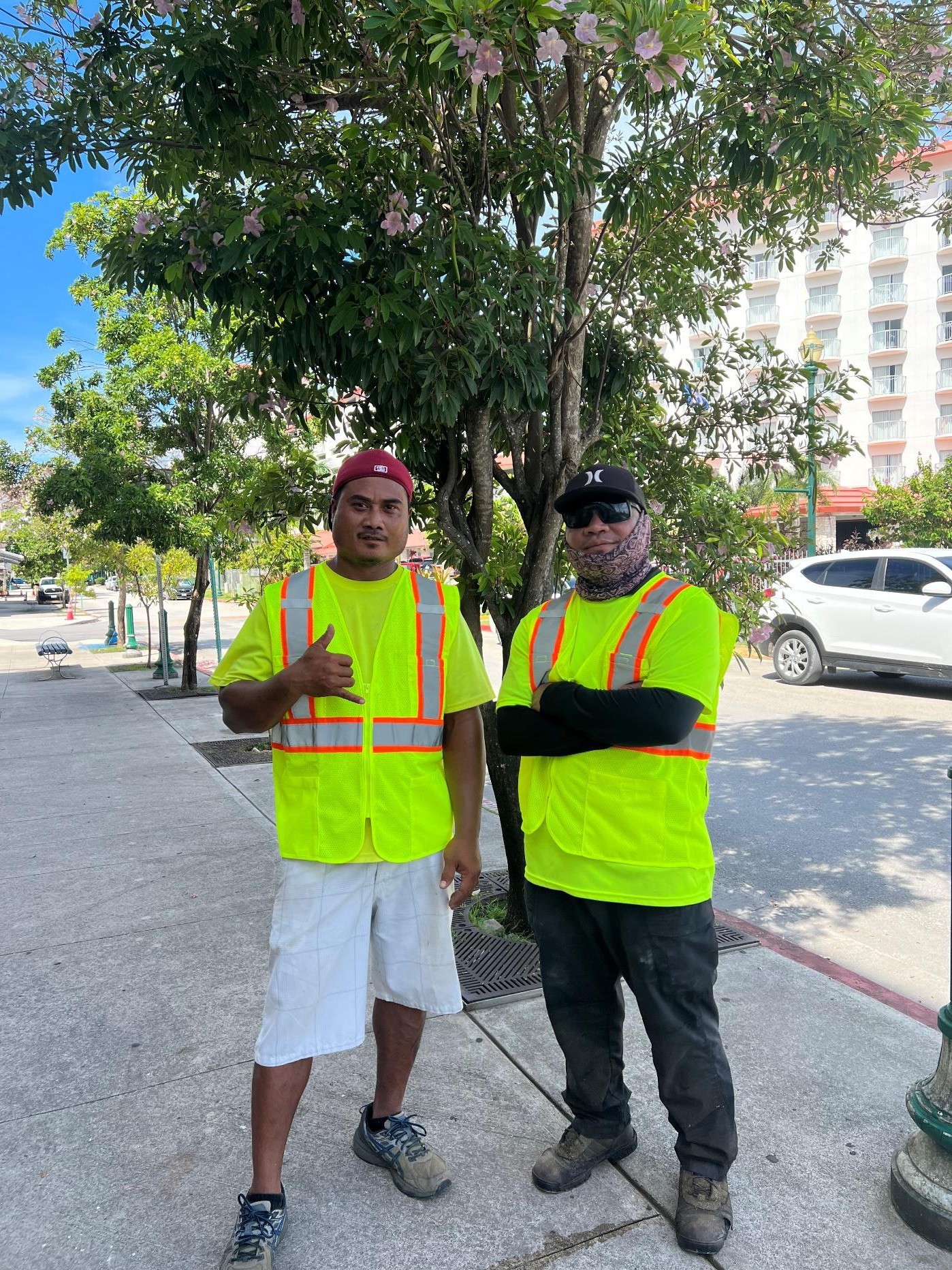 Jeffrey David, left, and Dennis Reyes of LJ’s Lawncare Service take a breather from cleaning major streets in Garapan on Aug. 7, 2024, as part of the Marianas Visitors Authority’s ongoing contribution to enhance the main tourist district.  MVA is encouraging area businesses to clean up their adjacent areas as the Garapan Revitalization Project enters its next phase.