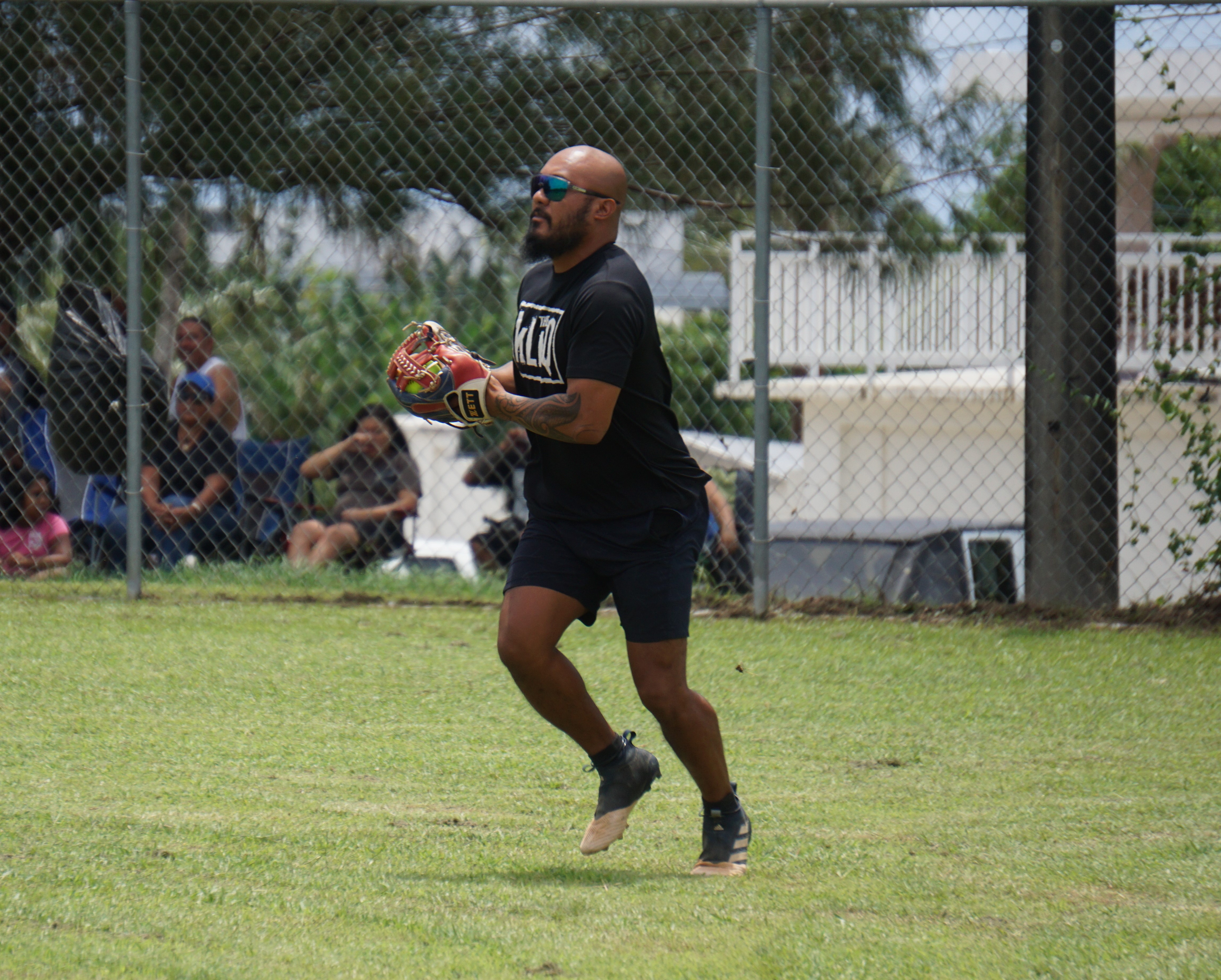 The Kliq's Zack gathers for the infield throw after securing a line drive during a game against Red Torch in the 2024 Budweiser Belau Amateur Softball Association Open League at the Dandan baseball field on Sunday.