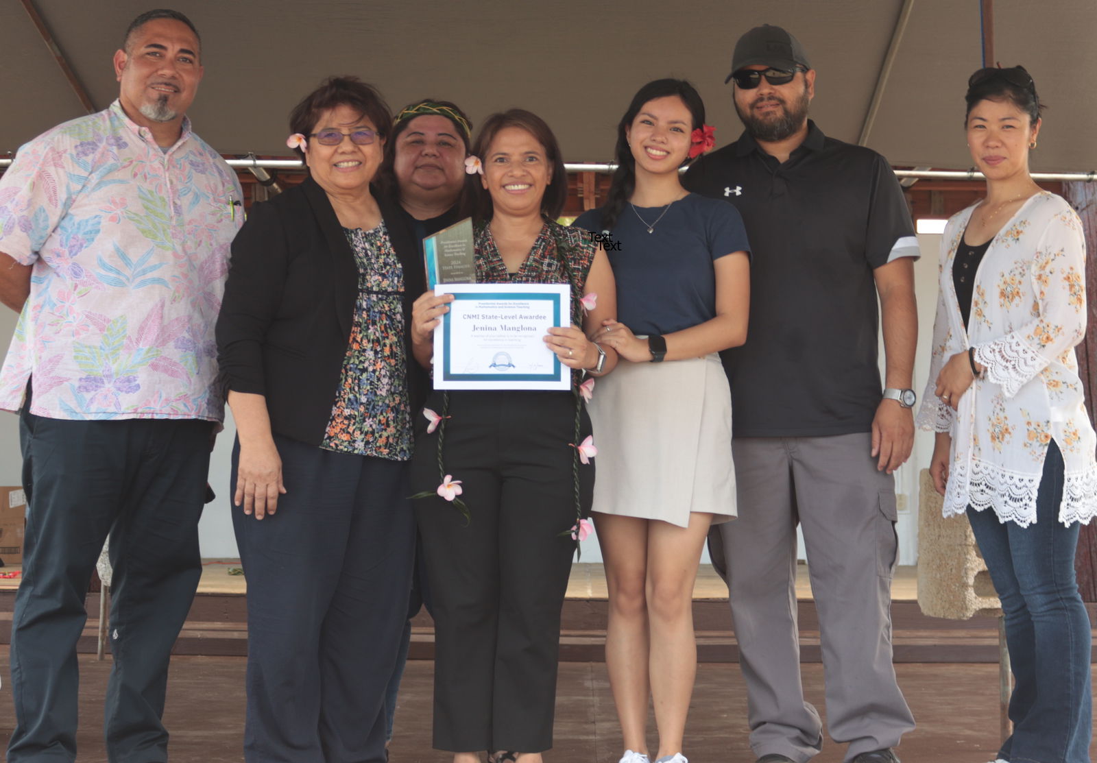 Tinian Elementary School educator Jenina Manglona, 4th left, joined by her family, is honored by the Public School System’s Office of Curriculum and Instruction-Science Program as this year’s CNMI winner of the prestigious Presidential Awards for Excellence in Mathematics and Science Teaching. Senior Director Jackie Quitugua and Program Director Asapmar Ogumoro and Tinian Elementary School Principal Lou Connie Manglona and Vice Principal April Manglona presented the award.