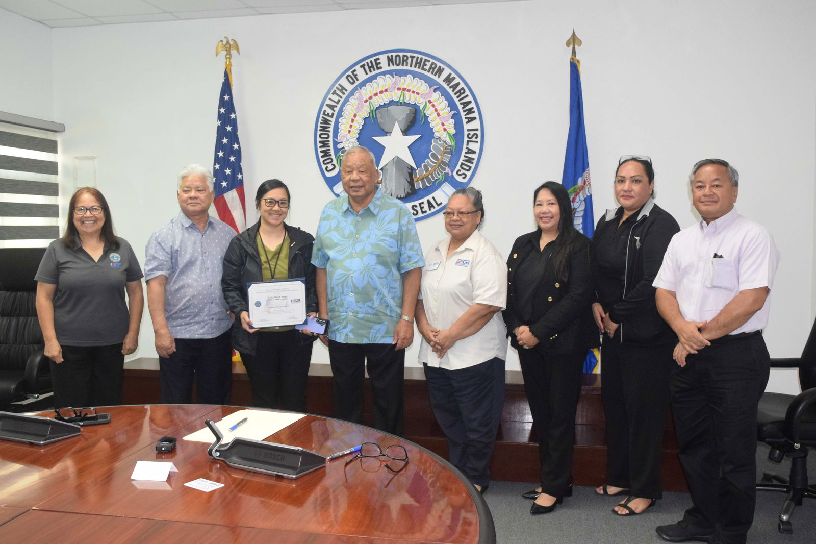 Office of Adult Probation supervisor Nadia Mae B. Moses, third left, holds her Patriot Award as she poses for a photo with Employer Support for the Guard and Reserve-CNMI Area Chair Rita A. Sablan, EdD, Gov. Arnold I. Palacios, Lt. Gov. David M. Apatang, Employer Outreach Coordinator Rose Igitol, ESGR State Ombudsman Joann T. Aquino, ESGR volunteer Tanya David and Civilian Aide to the U.S. Secretary of the Army Mike Sablan in the governor's conference room on Monday.