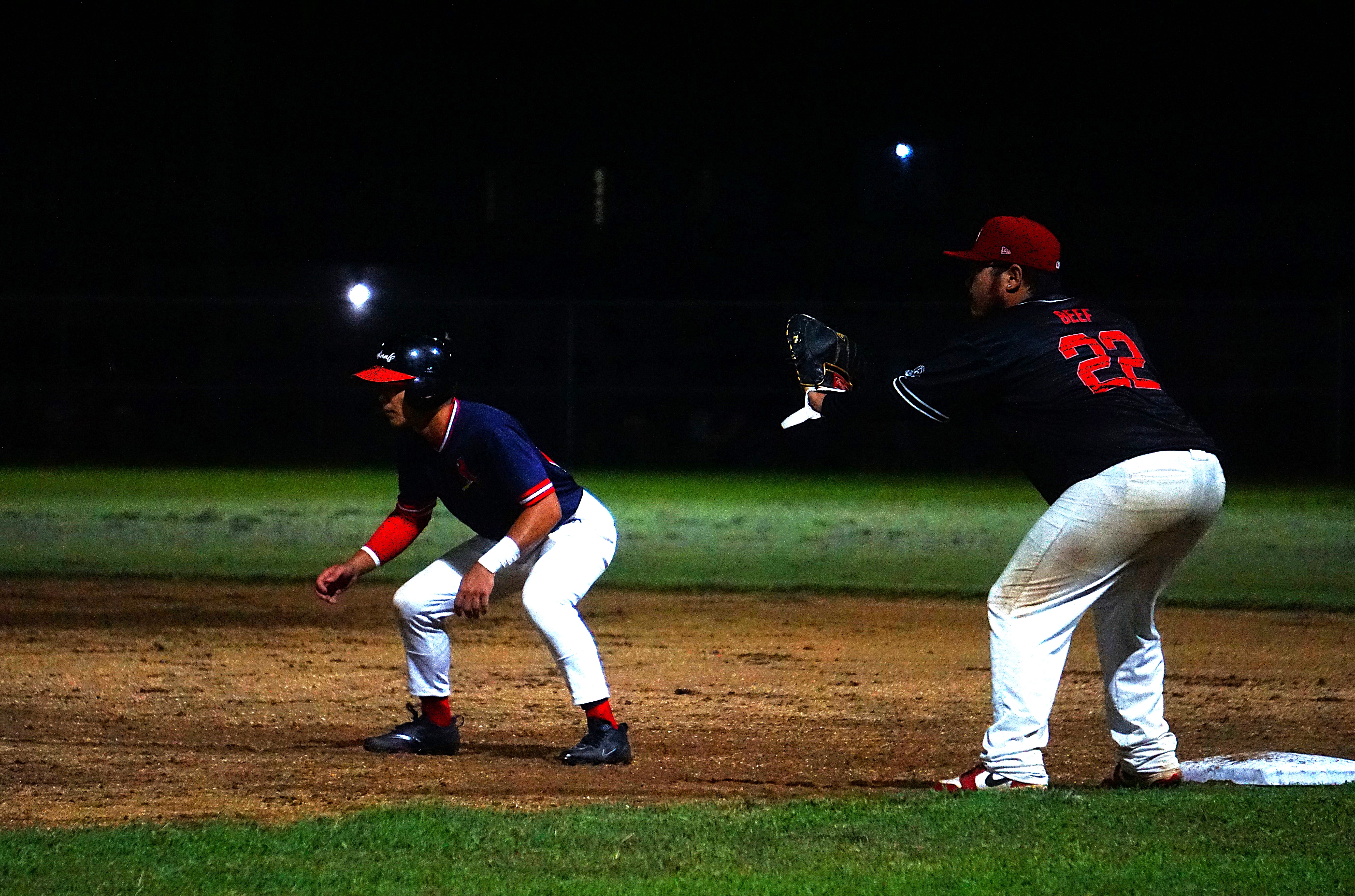 The Cardinals' Pat Tenorio gains some distance before his attempt to steal second base against the Braves in the playoffs of the 2024 Tan Holdings Saipan Baseball League  at the Francisco "Tan Ko" Palacios Baseball Field.