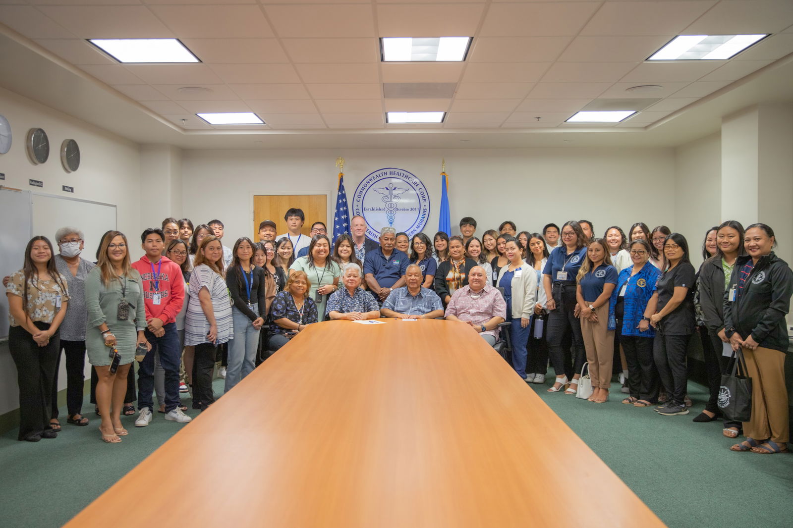 Gov. Arnold I. Palacios, Lt. Gov. David M. Apatang, CHCC CEO Esther L. Muna and Commissioner of Education Dr. Lawrence Camacho pose for a photo with CHCC management and staff during the proclamation signing for National Immunization Awareness Month.CHCC photo