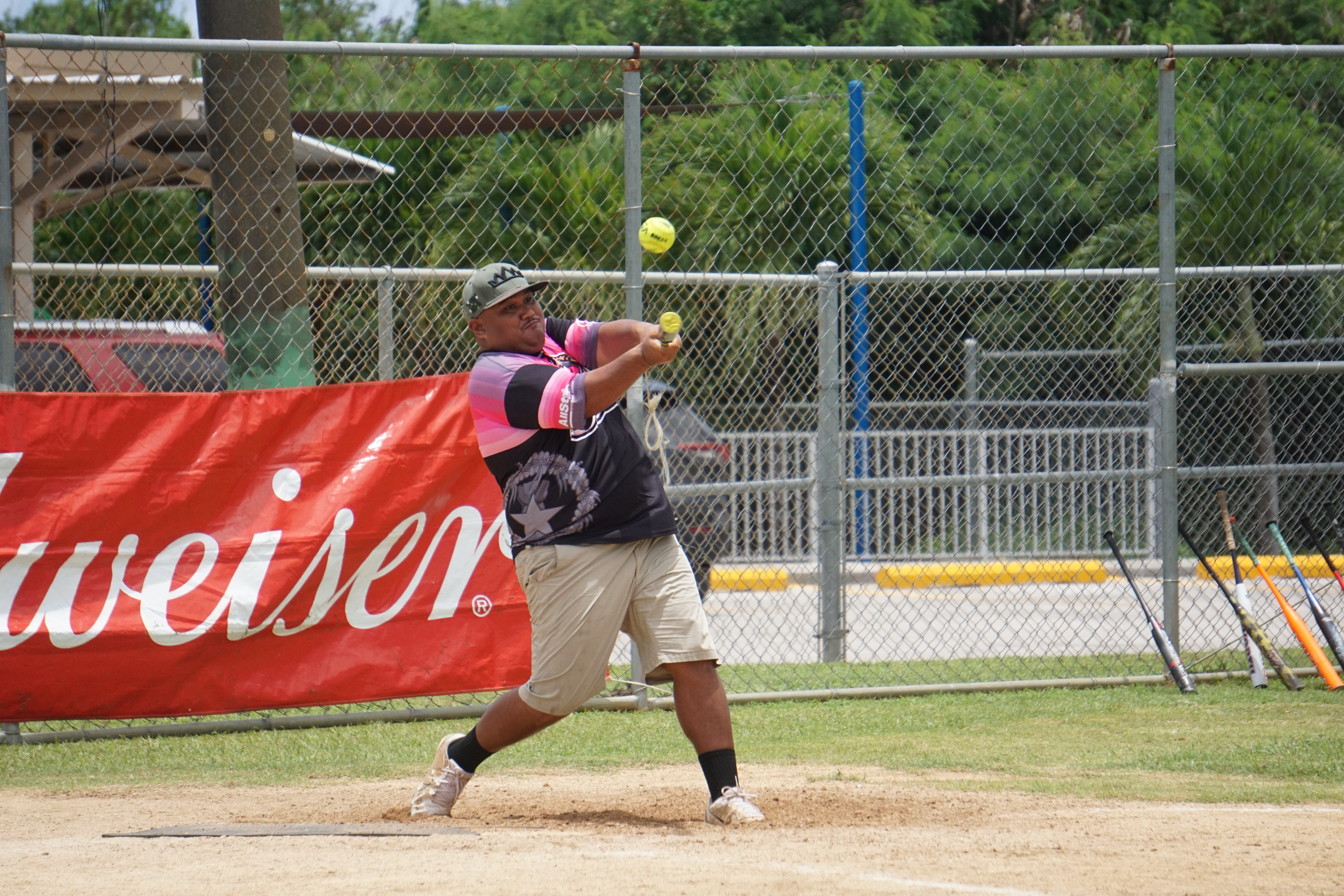 An Aimeliik Bat Boy connects for a hit during a game in the 2024 Budweiser Belau Amateur Softball Association Open League at the Dandan baseball field.