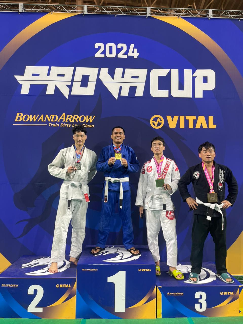 Jason Atrero poses with the gold medal along with the other top finishers in the white belt 67kg division of the Prova Brazilian Jujitsu Championship at the Hwaseongsi Sports Stadium’s indoor gymnasium in South Korea on Saturday.