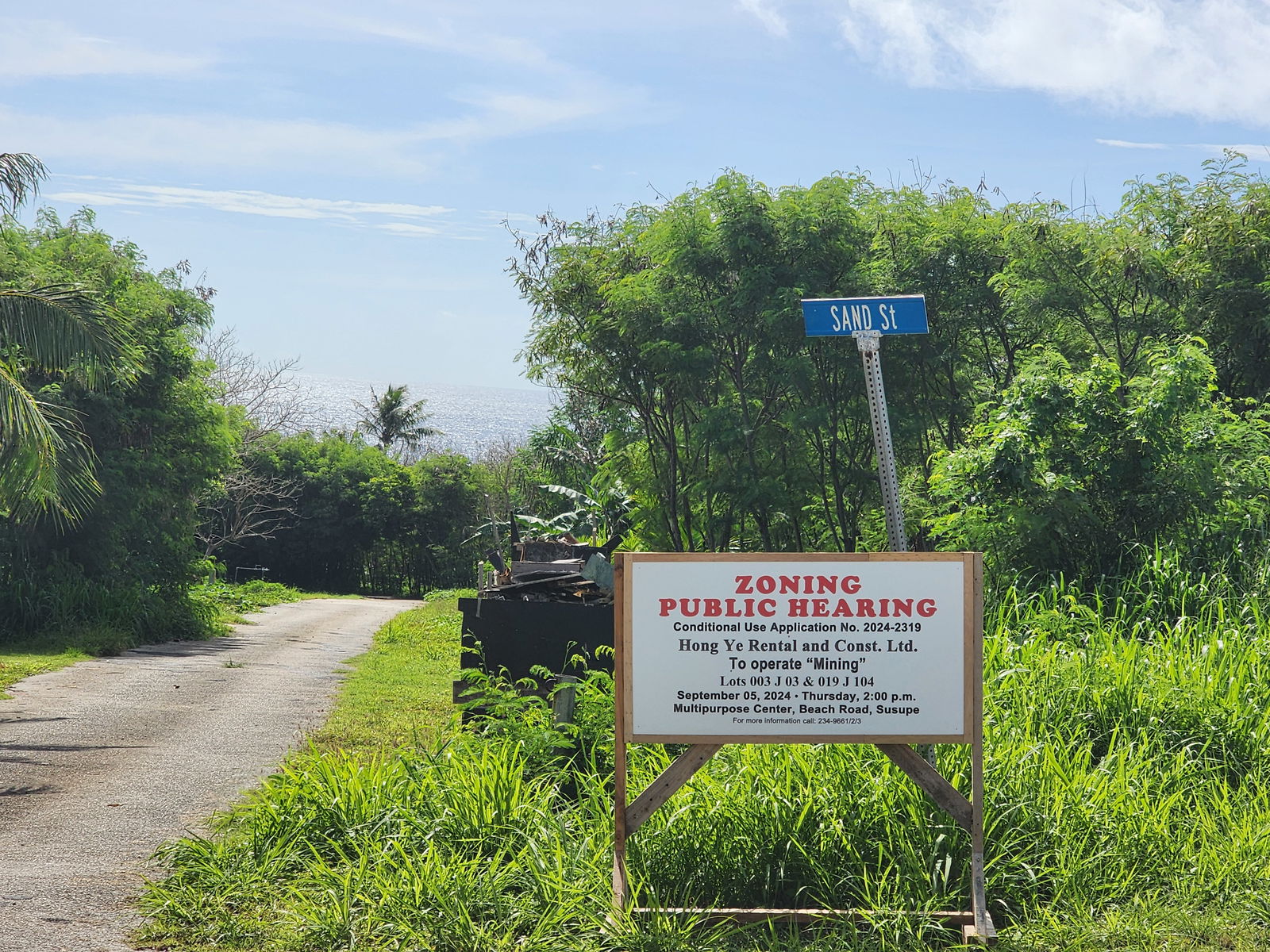 A sign regarding a zoning public hearing on Hong Ye’s conditional application use is seen on Sand Street in Dandan.