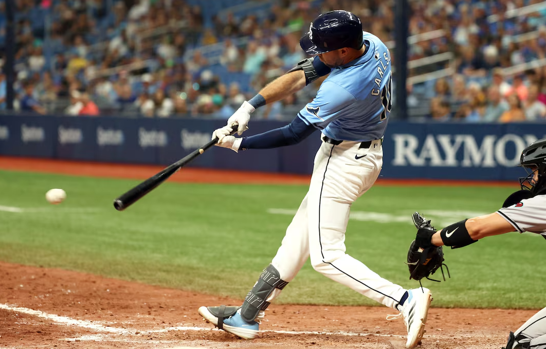 Tampa Bay Rays outfielder Dylan Carlson (10) singles against the Arizona Diamondbacks during the tenth inning at Tropicana Field in St. Petersburg, Florida, Aug. 18, 2024.