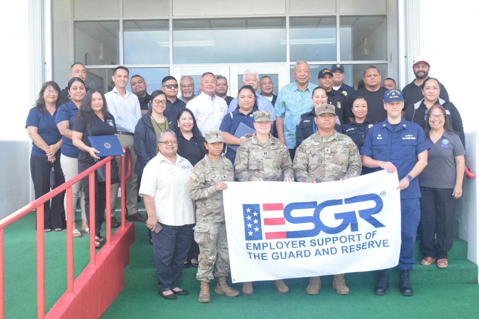 Gov. Arnold I. Palacios and Lt. Gov. David M. Apatang pose Employer Support for the Guard and Reserve-CNMI Area Committee members, other CNMI officials and the recipients of the Patriot Award after a proclamation signing at the governor’s office on Monday.