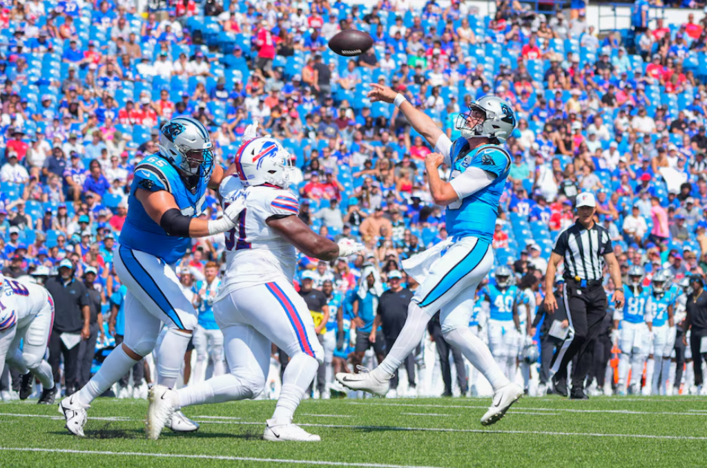 Carolina Panthers quarterback Jack Plummer (16) throws the ball for a two-point conversion against the Buffalo Bills during the second half at Highmark Stadium in Orchard Park, New York, Aug. 24, 2024.