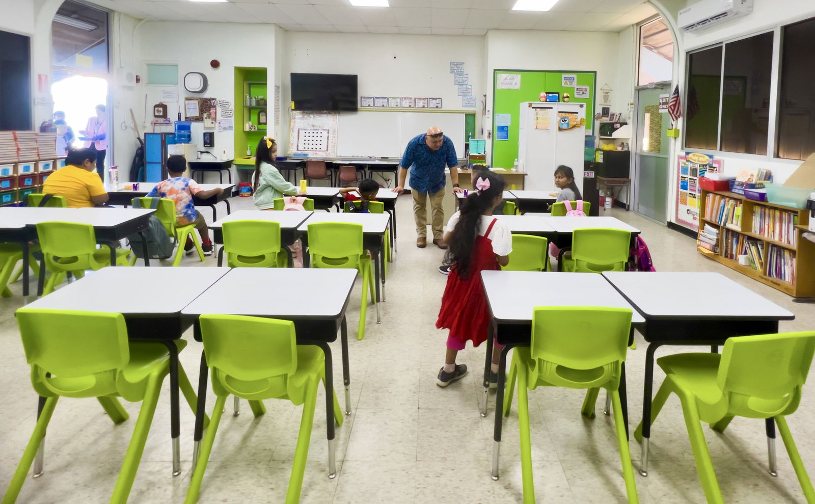 During a classroom tour at Garapan Elementary School on Tuesday, the first day of the new school year, second graders are greeted by Commissioner of Education Dr. Lawrence Camacho. 