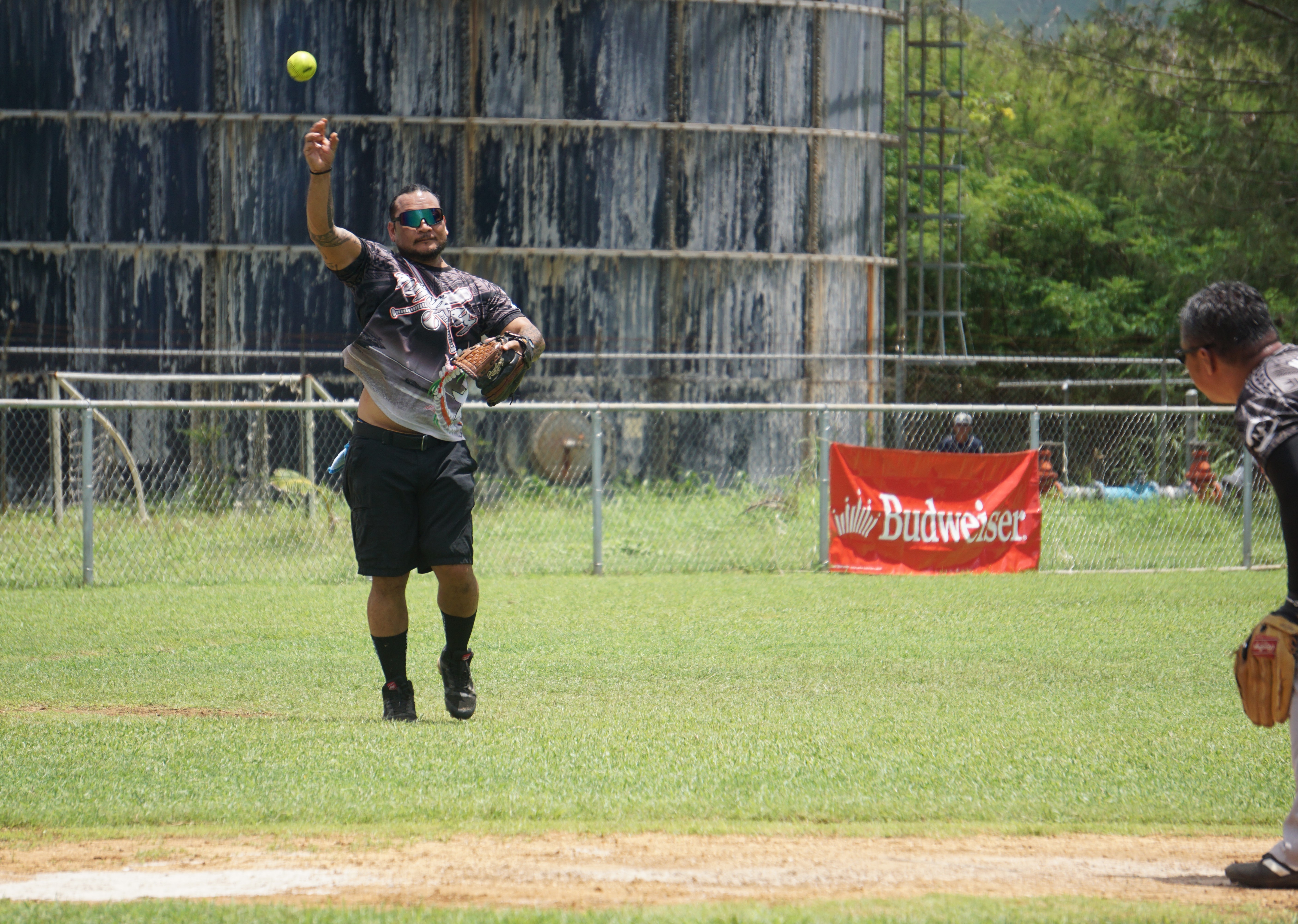 Taotao Mona third baseman Franklin Lizama throws to first base for the out during their opening game against AB Team in the 2024 Budweiser Belau Amateur Softball Association Open League at the Dandan baseball field on Sunday.