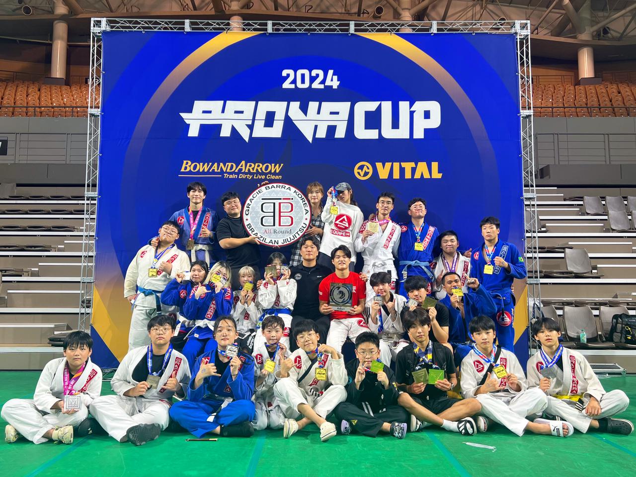 Jason Atrero and other members of the All Round Jiu Jitsu gym pose for a group photo.