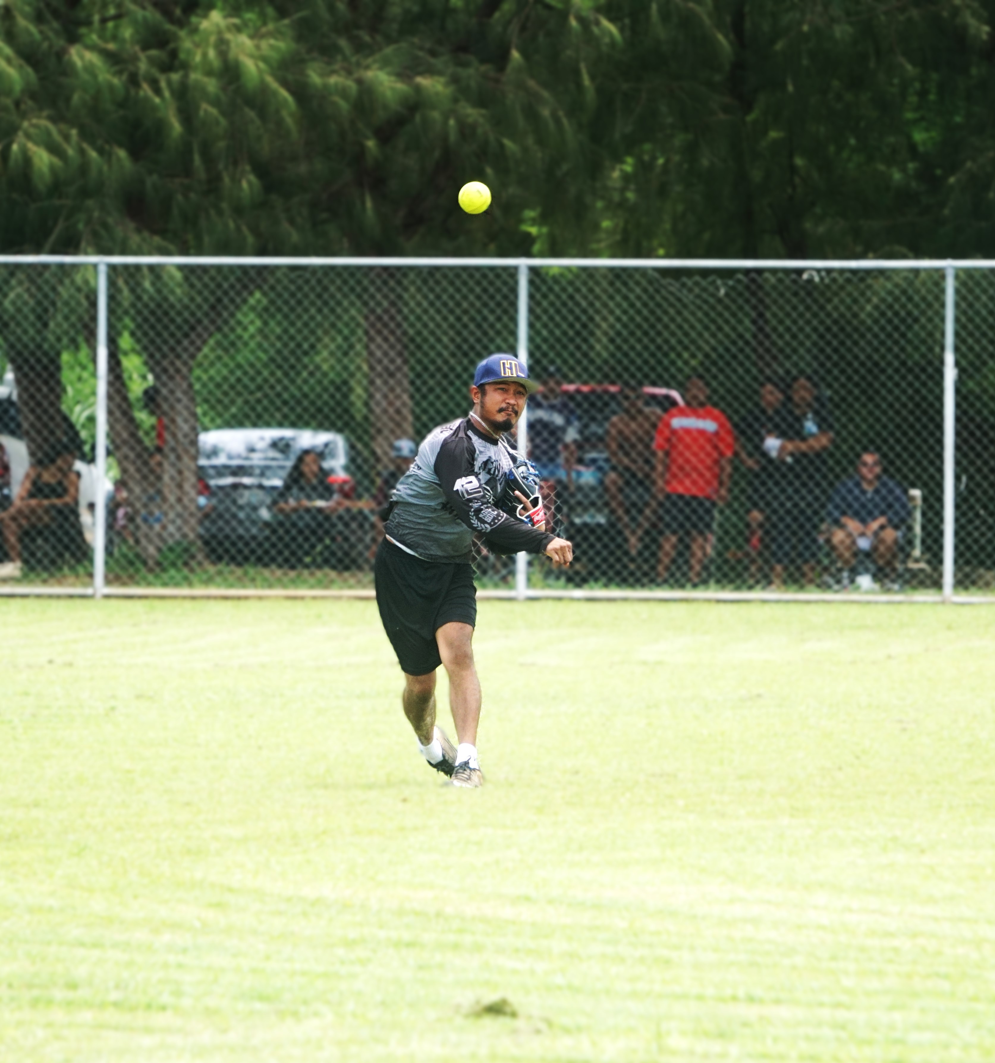Pare Pack shortstop Verlance Secharmidal throws to first base for the pick off during a game against the AB Team in the 2024 Budweiser Belau Amateur Softball Association Open League at the Dandan baseball field on Sunday.