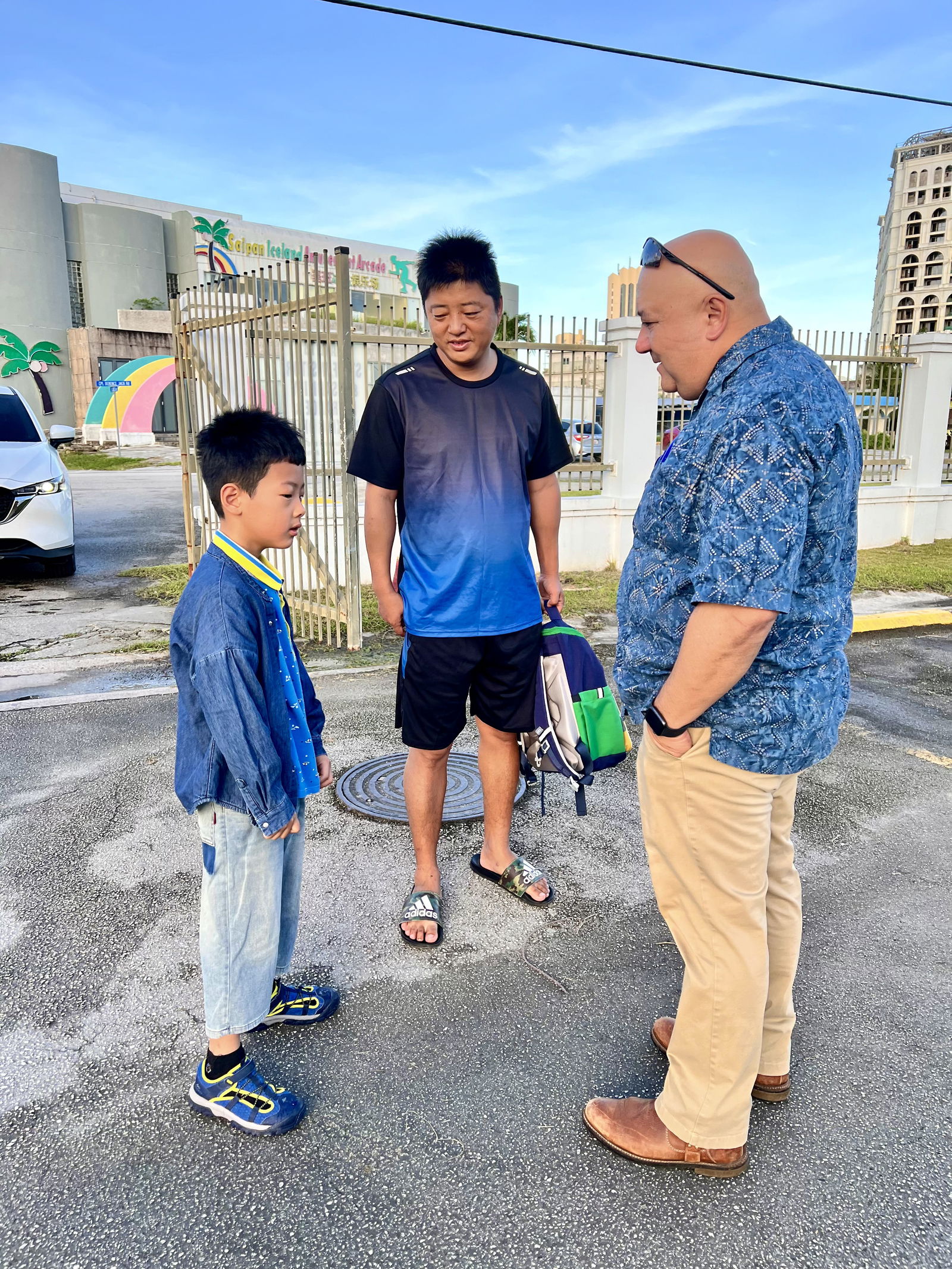 New student James and his father are met by Commissioner of Education Dr. Lawrence Camacho at Garapan Elementary School. James is attending school on Saipan for the first time.