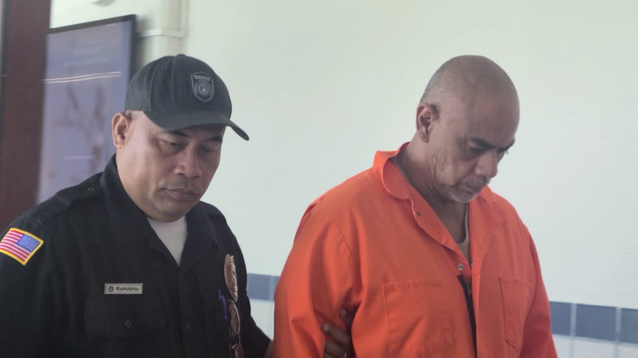 Glenn Sablan Palacios, right, is escorted by a Corrections officer after a bail hearing on Monday.
