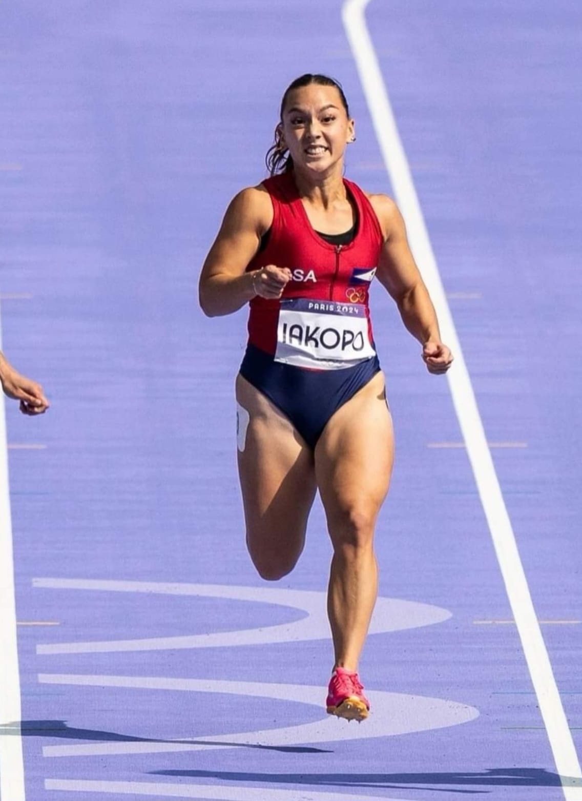 Filomenaleonisa Iakopo pushes through the finish line during the women's 100M event of the Olympic Games in Paris, France on Friday.