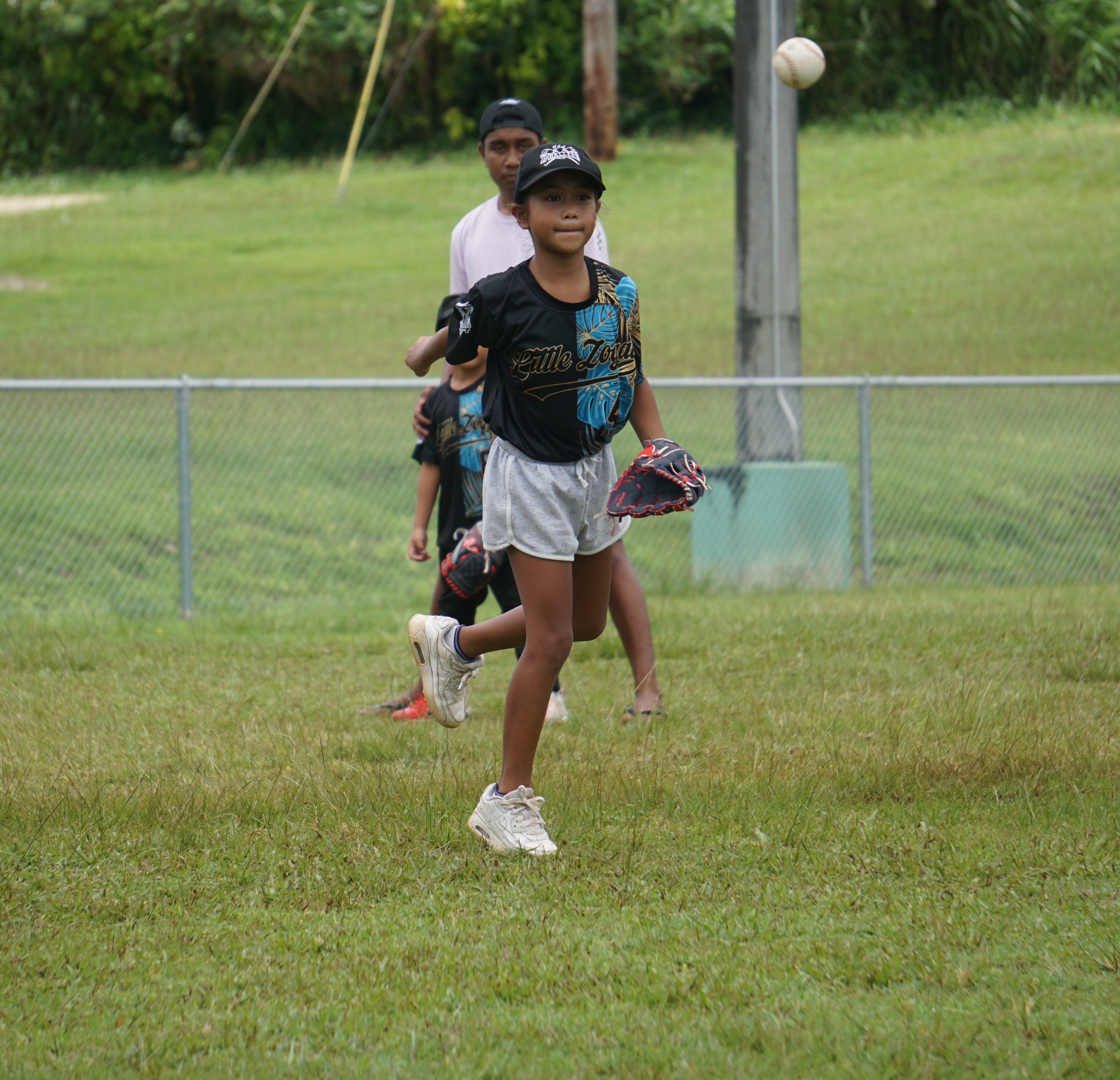 A Little Zogai player throws the ball to first base for an out during a game against the Little Rascals in the 2024 Natibu Sports Association “Cover Home” Tee-Ball Summer League at the Capital Hill softball field on Saturday.