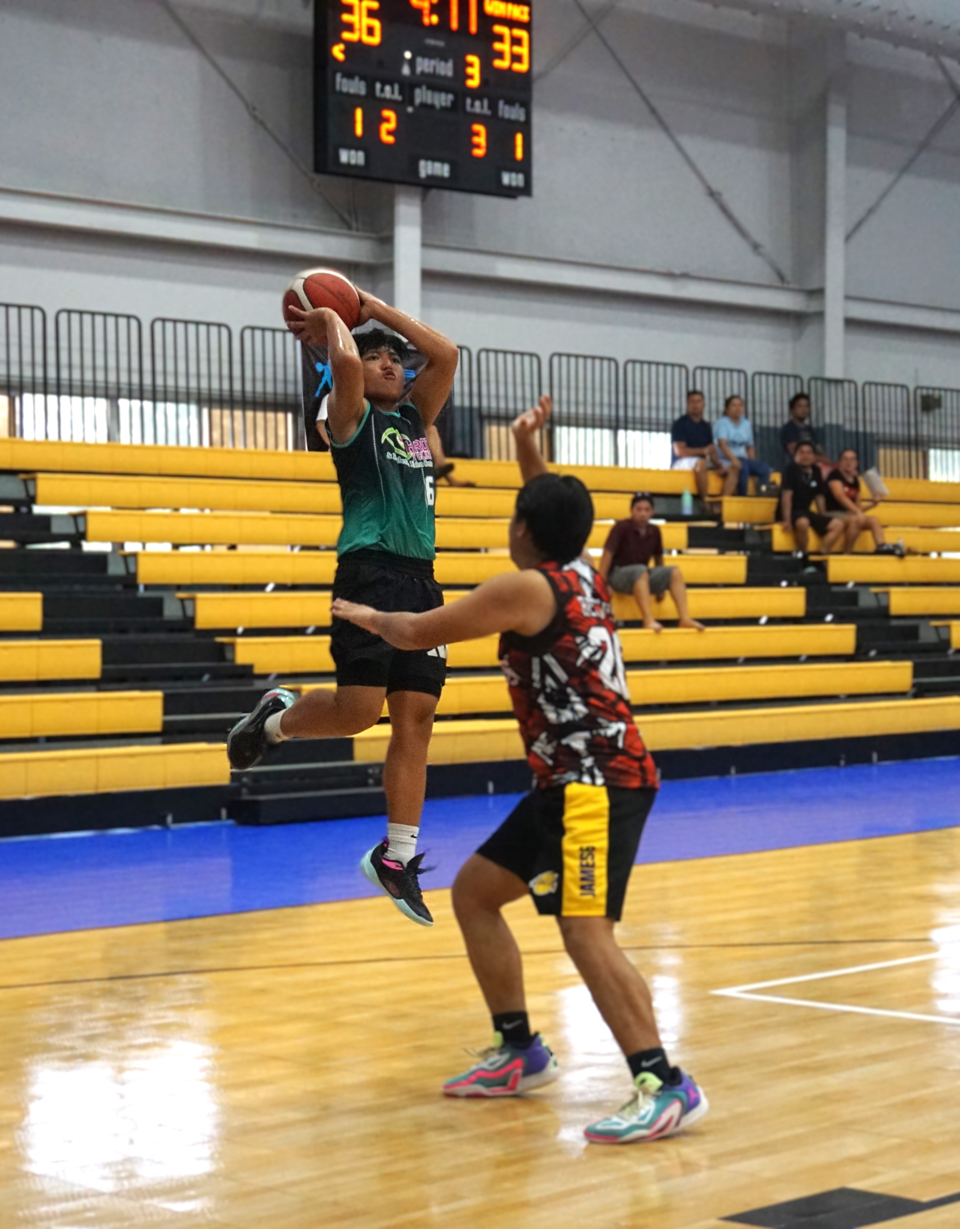 Hardt Eye Clinic's Jezpher Navarro takes the fadeaway jump shot during a game against Win Pacific Corp in the Ali’i Madflex Sports Summer Youth Basketball Tournament 2024 at the Ada gym on Saturday.