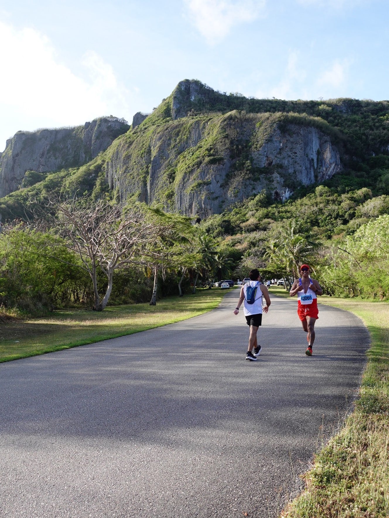 Moises Jr. Ernesto, right, and other runners pass through Marpi on the full marathon course in the Skechers Saipan Marathon 2024. Registration is now open with early bird rates at www.raceroster.com for Saipan Marathon 2025 on March 8.