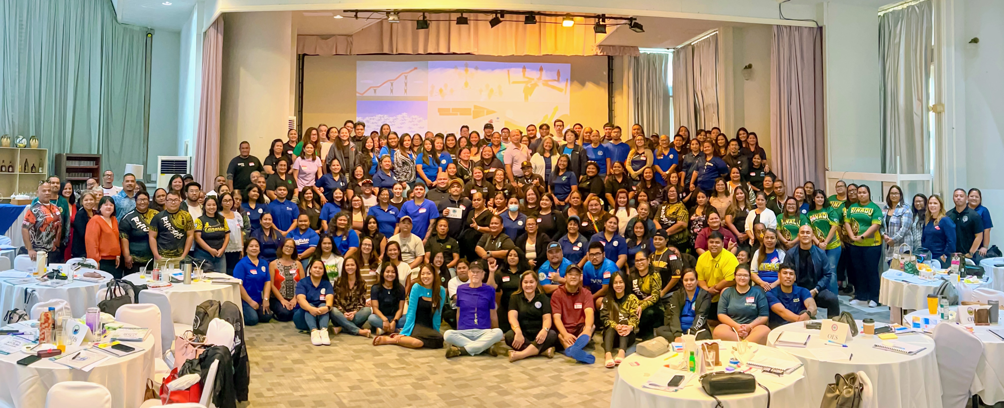 About 200 Special Education Program professionals, including related service providers, led by Special Program Director Donna M. Flores, pose for a photo with Public School System officials during a back-to-school professional development session at Grandvrio Resort Saipan on Friday. 