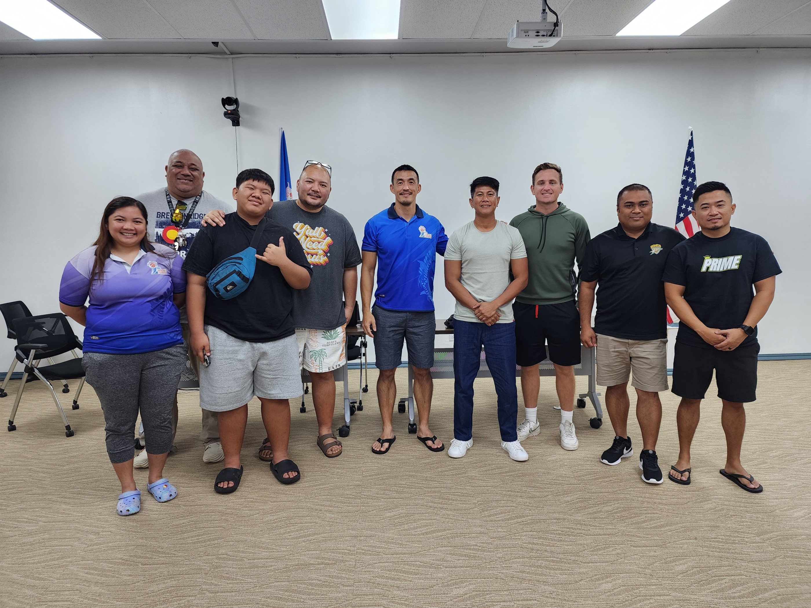 Northern Mariana Islands Basketball Federation President James Lee poses for a photo with VP David Apatang Jr., Secretary Michael Mercado, board member Marene Lumabi, club representatives and other basketball enthusiasts at the conclusion of NMIBF’s general membership meeting in the conference room of the Ada gym on Saturday.