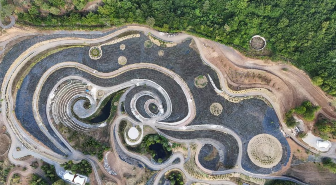 A drone view of a park transformed into a replica of Vincent Van Gogh's famous painting, “The Starry Night,” featuring fields of lavender, shrubs, and lakes connected by an array of paths — a project that mirrors the celebrated artwork in a natural setting in Visoko, Bosnia and Herzegovina, Aug. 3, 2024.