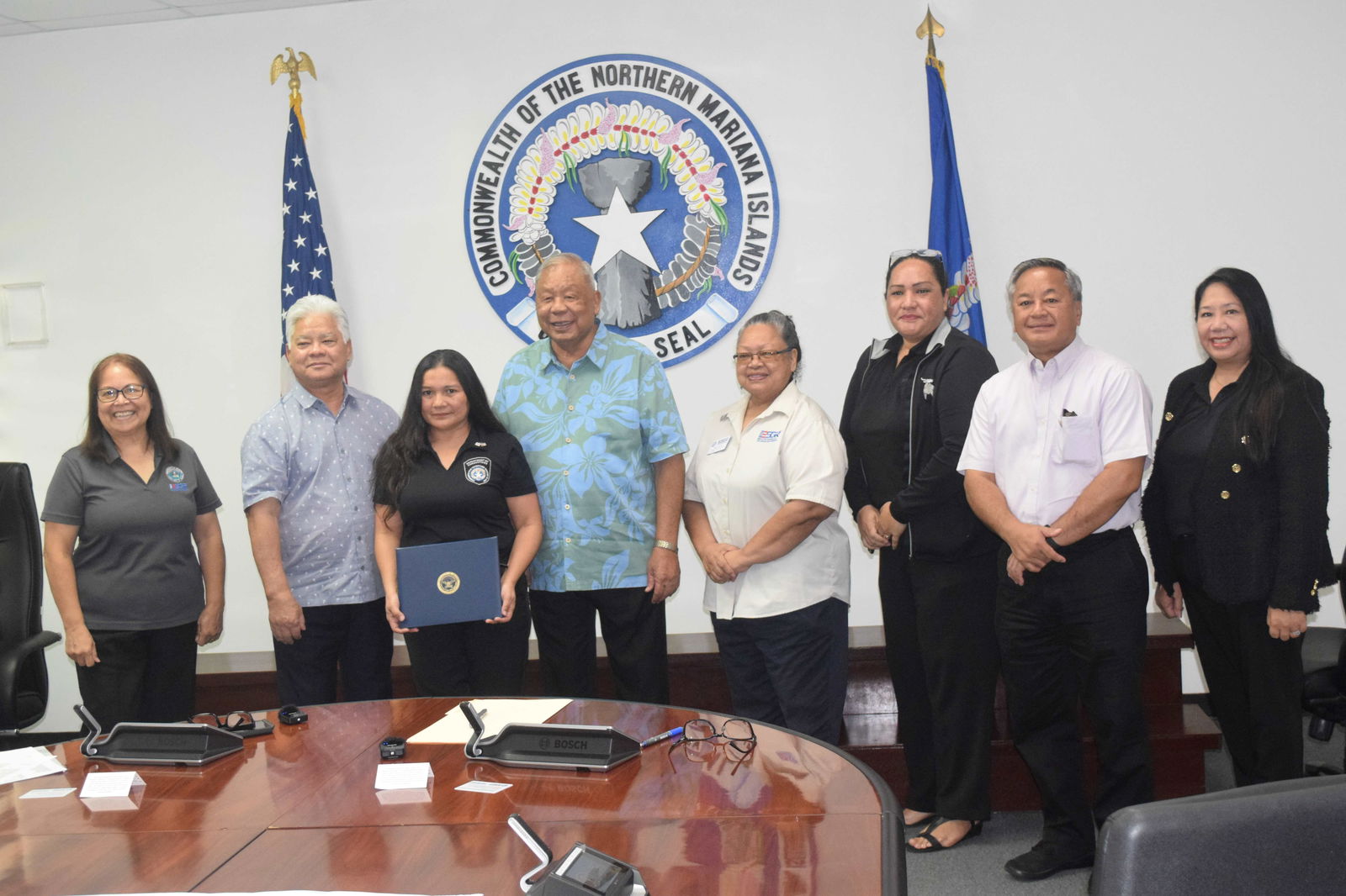 Department of Corrections supervisor Rita Iglesias holds her Patriot Award as she poses for a photo with ESGR Guan-CNMI Area Chair Rita A. Sablan, EdD, Gov. Arnold I. Palacios, Lt. Gov. David M. Apatang, Employer Outreach Coordinator Rose Igitol, ESGR State Ombudsman Joann T. Aquino, ESGR volunteer Tanya David and Civilian Aide to the U.S. Secretary of Army the Mike Sablan in the governor's conference room on Monday.