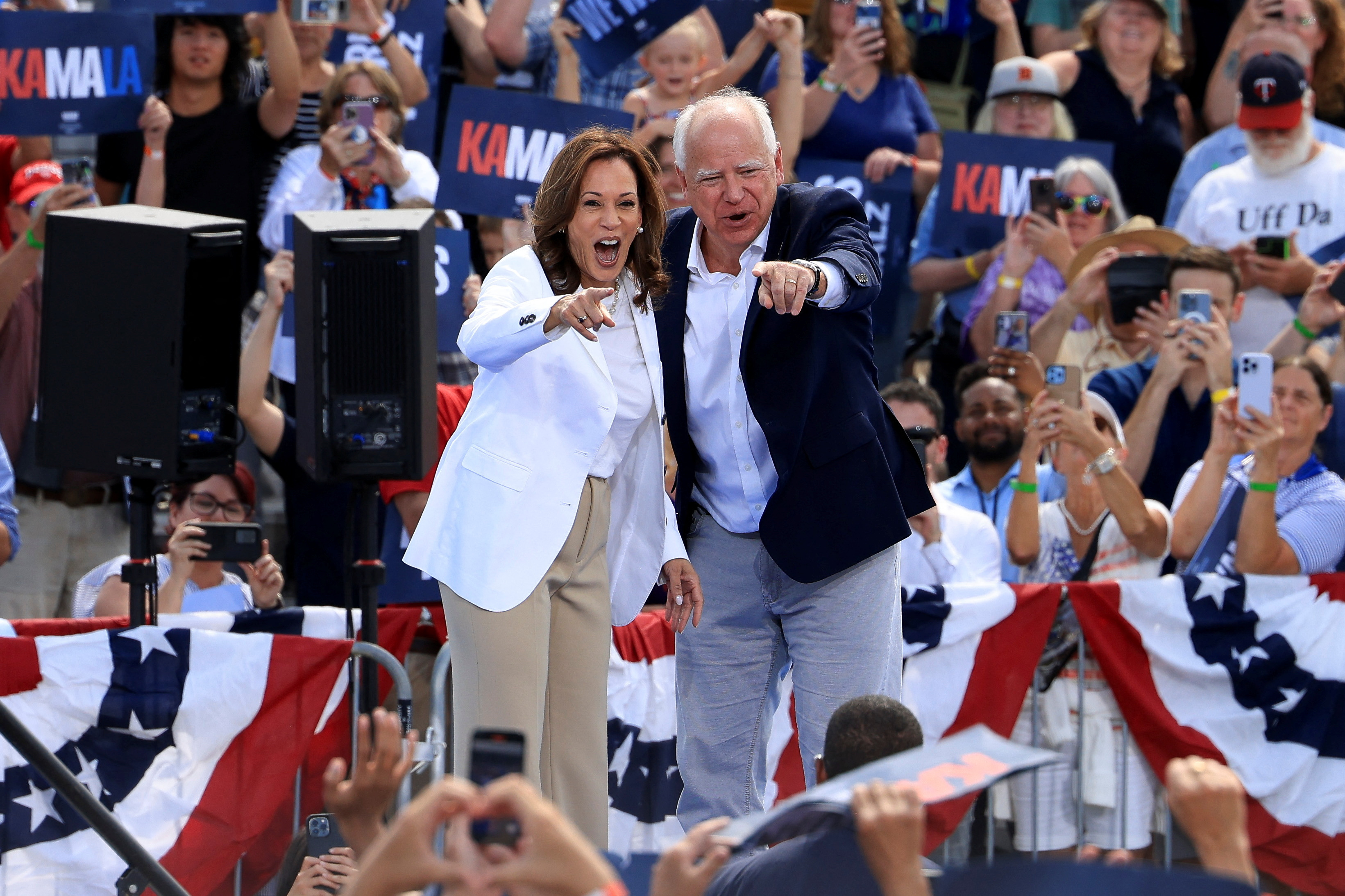 Democratic presidential candidate Kamala Harris and her running mate Tim Walz attend a campaign event in Eau Claire, Wisconsin, Aug. 7, 2024.