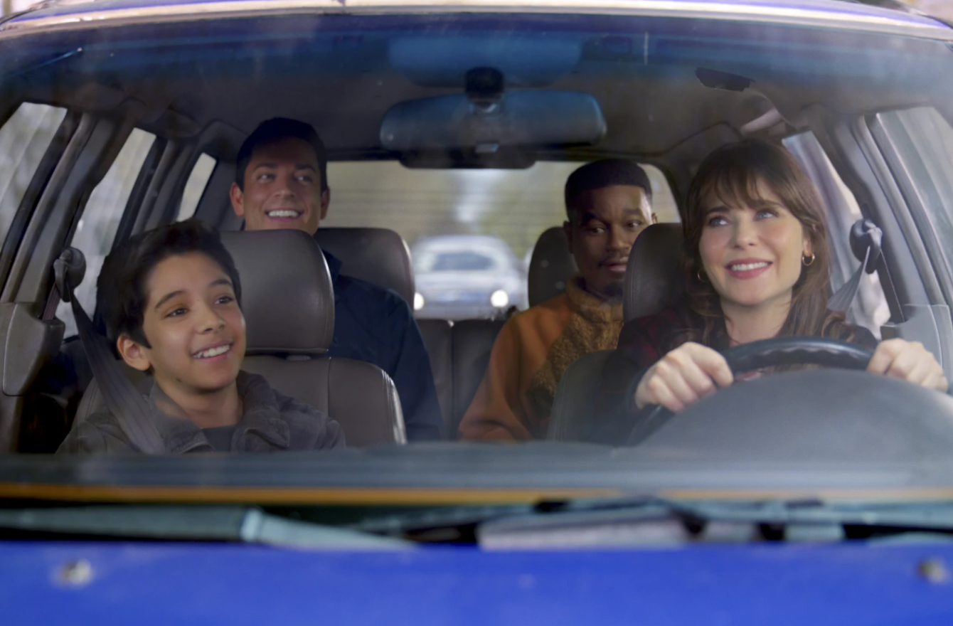 Zachary Levi, background left, Benjamin Bottani, left, Lil Rel Howery, background right, and Zooey Deschanel in a scene from “Harold and the Purple Crayon.”