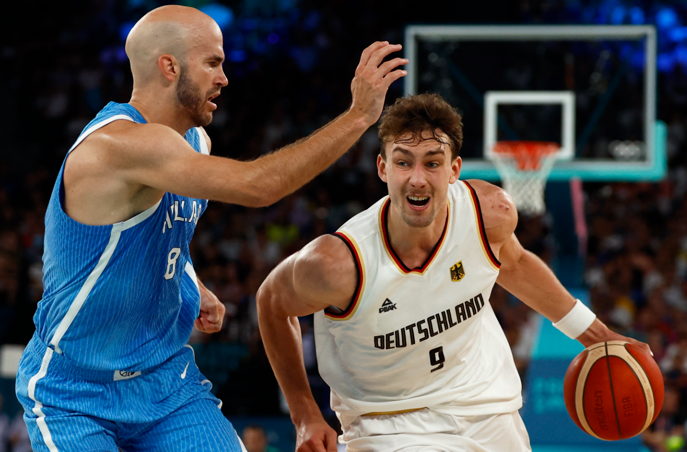 Franz Wagner of Germany in action against Nick Calathes of Greece in the men's basketball quarterfinal at Bercy Arena, Paris, France, Aug. 6, 2024.