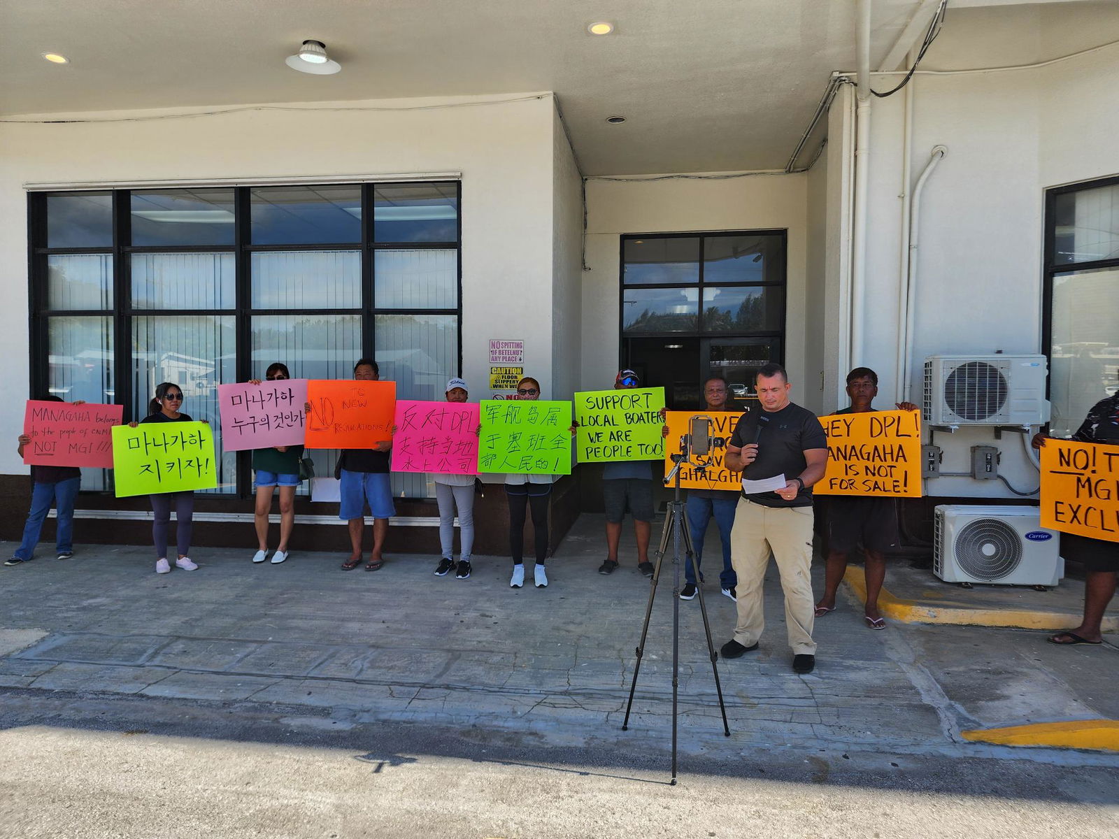 Marine sports operators and their employees stage a protest outside the Department of Public Lands office on Tuesday afternoon.
